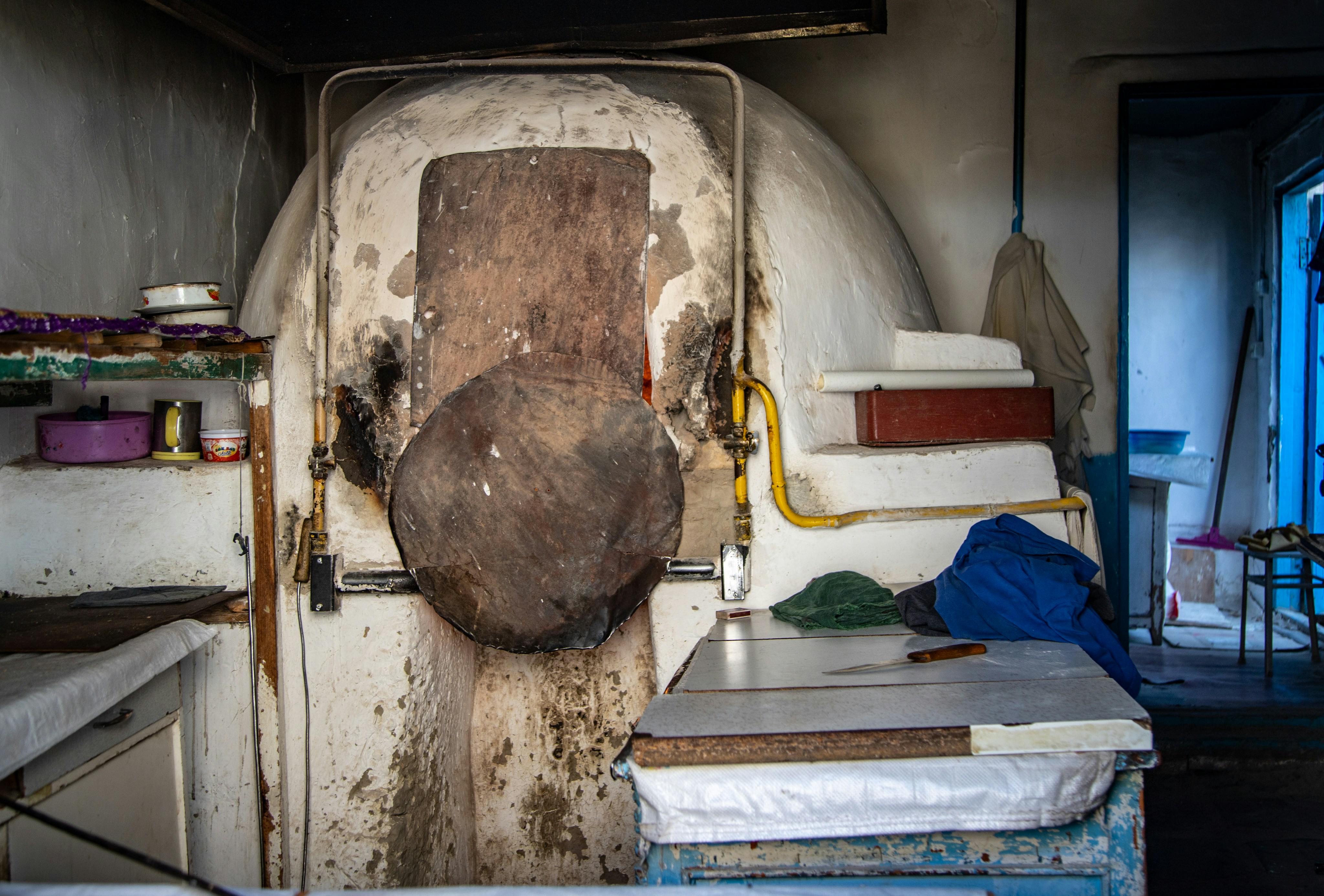 A cleaner scrubbing inside an oven door in a Dublin kitchen