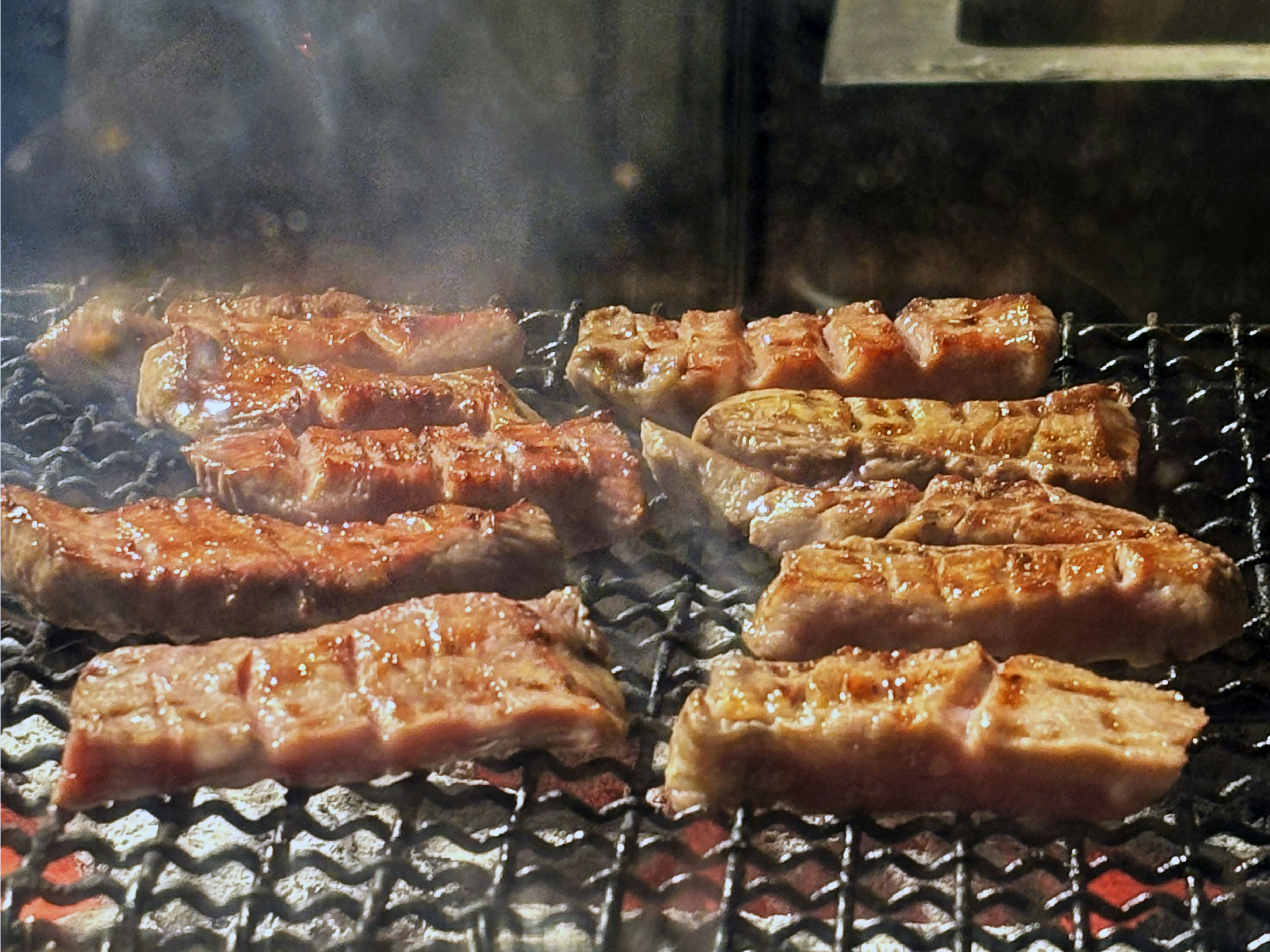 grilled pork belly on charcoal grill