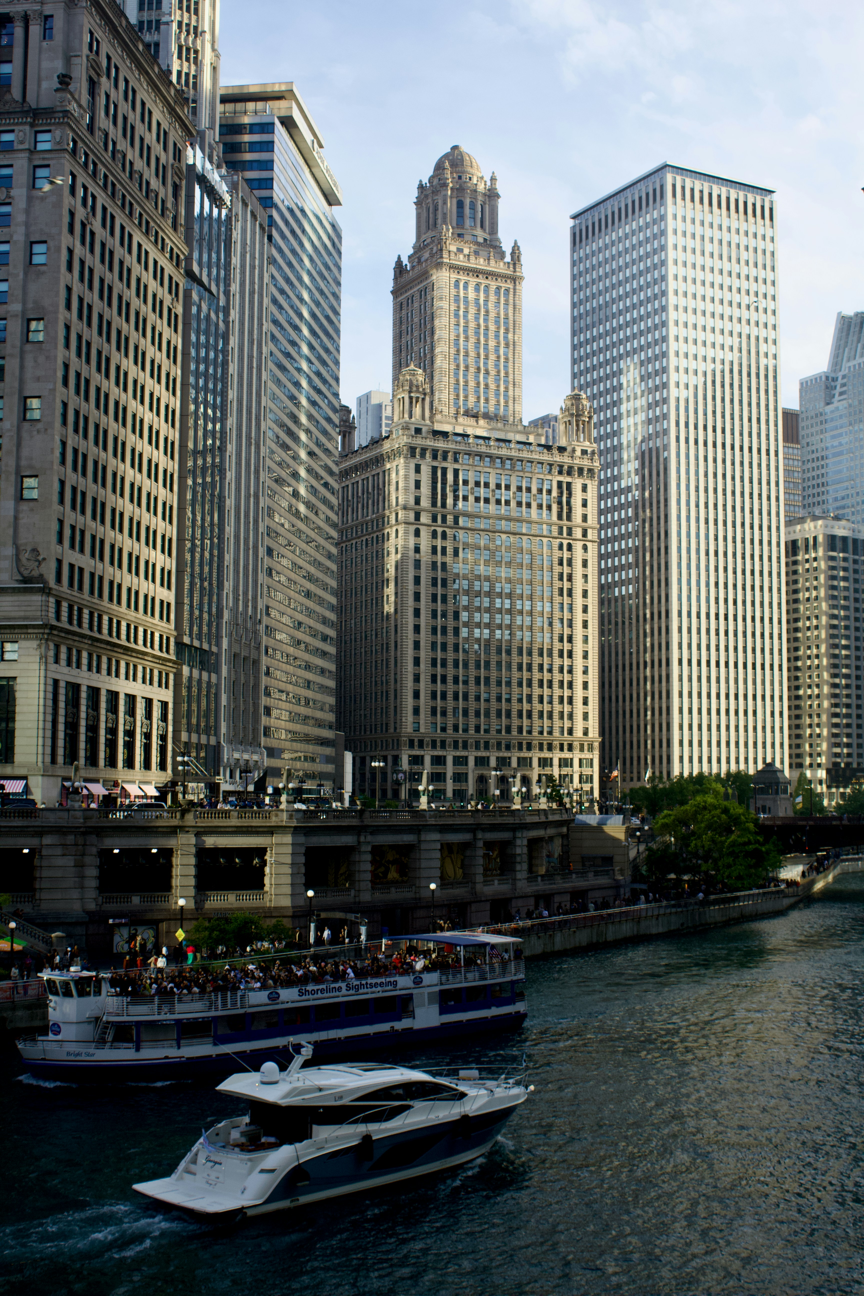 A sightseeing boat and a motor yacht on the Chicago River in Chicago