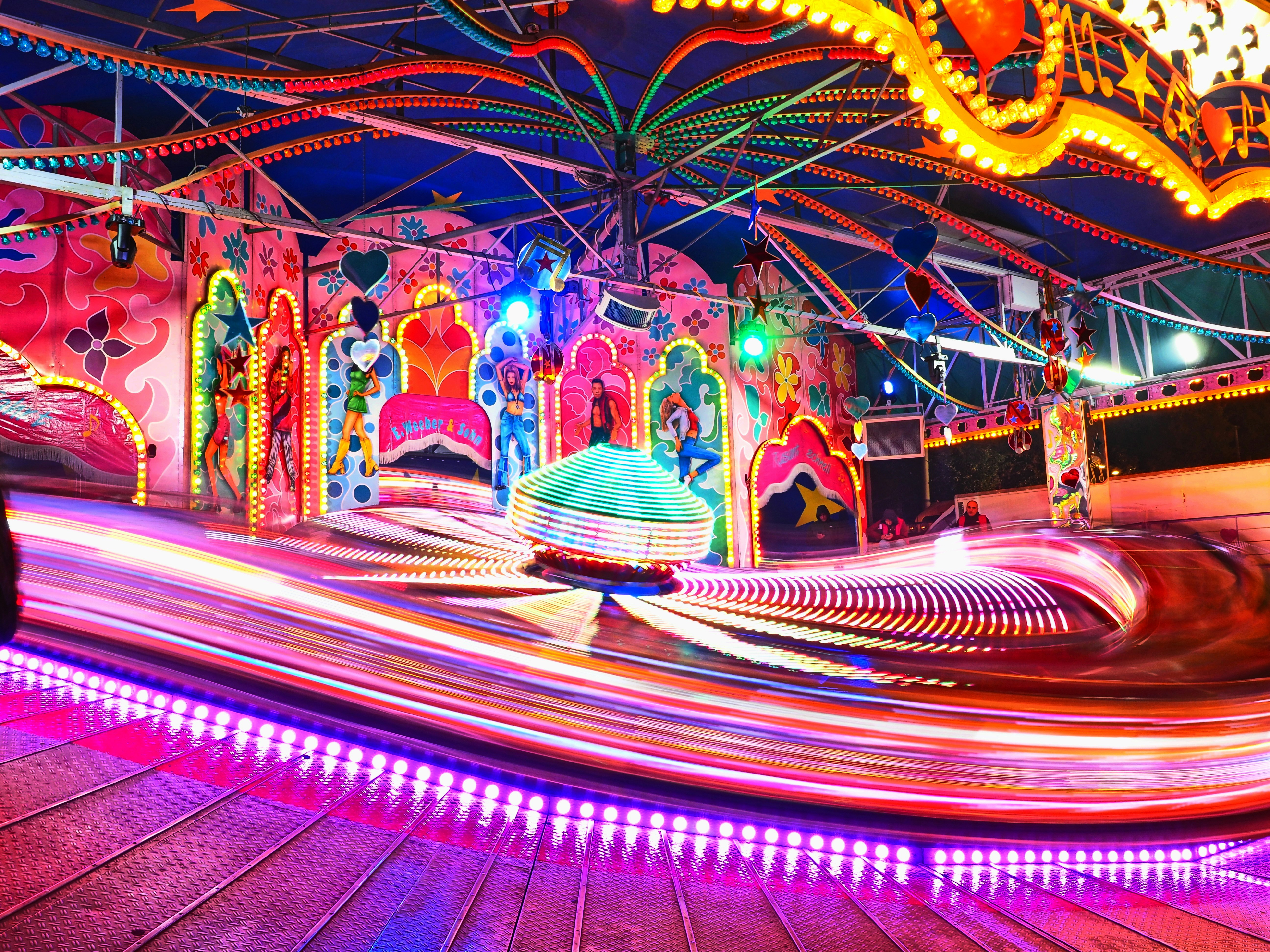 Spinning carnival ride with neon lights - Free Photo on Unsplash