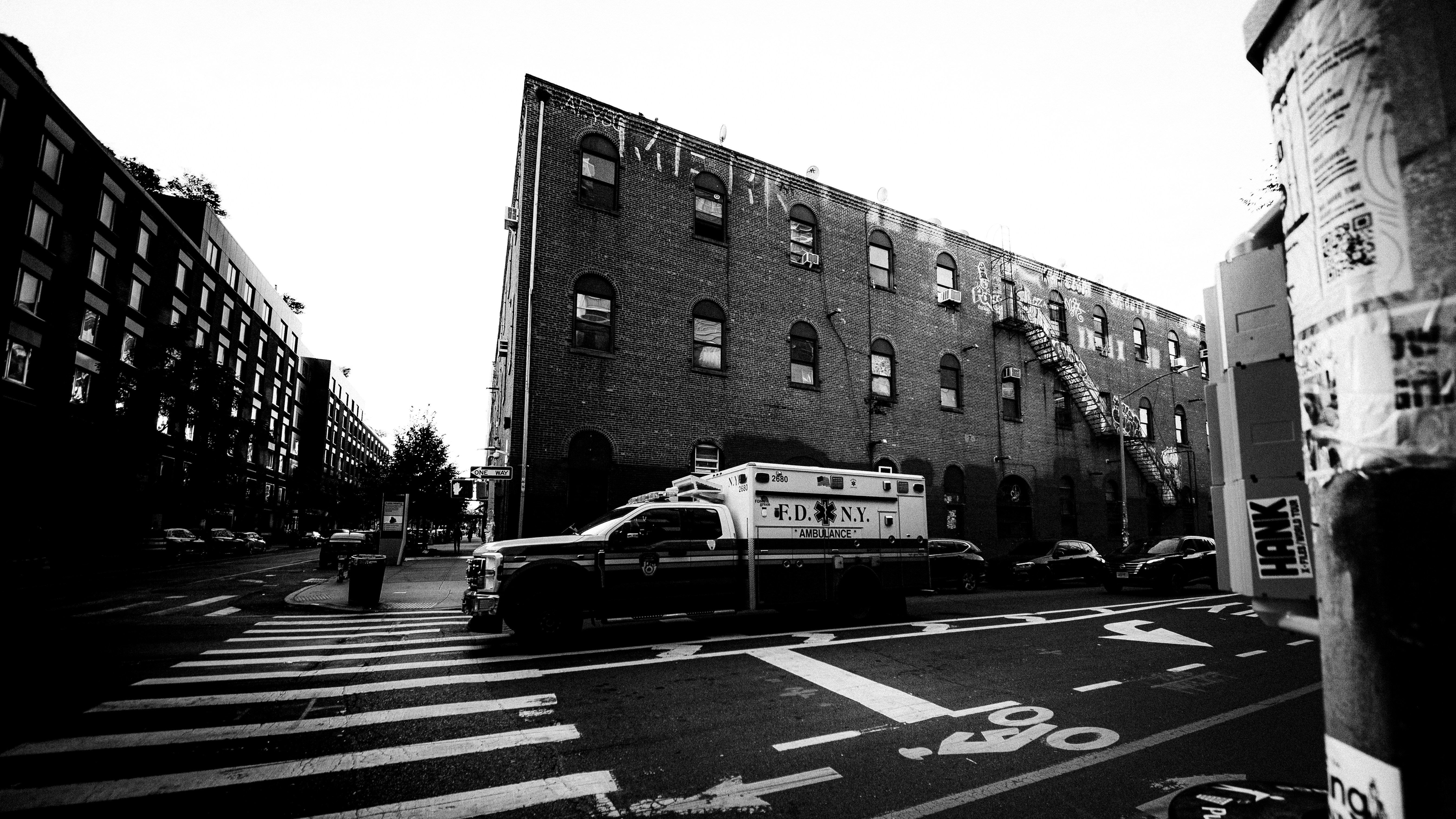 An FDNY ambulance parked at a crosswalk on a city street in New York