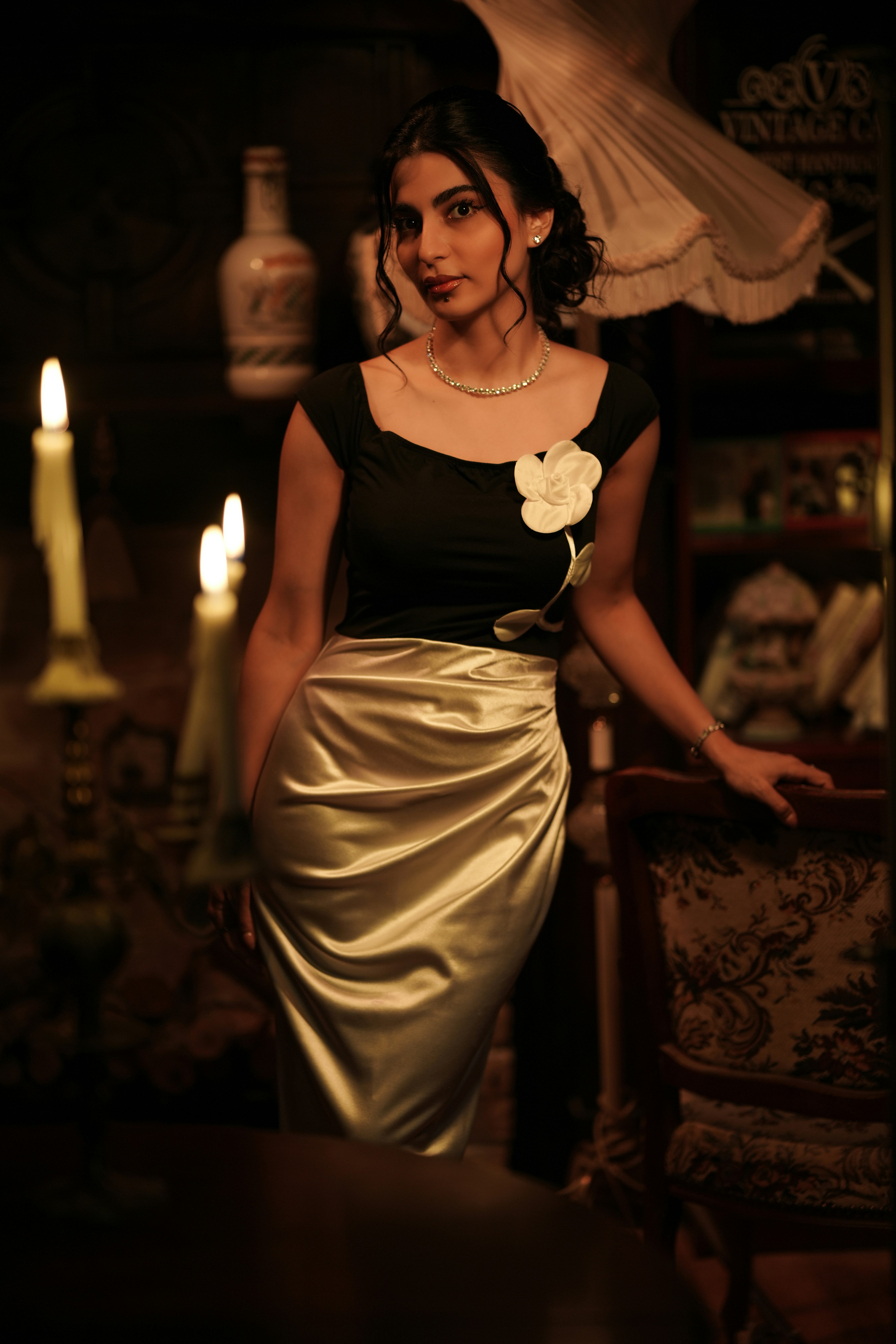 Standing by a dining table in a satin skirt