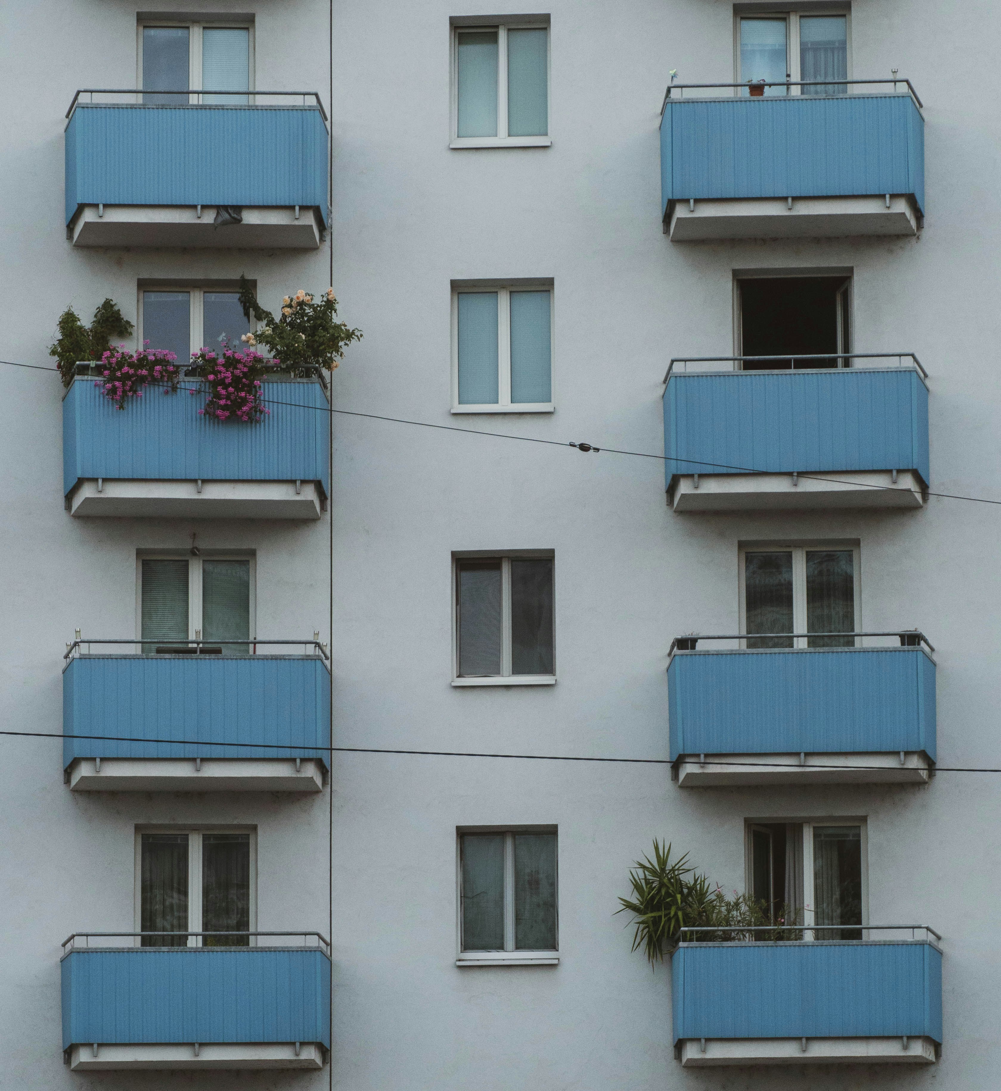 Apartment building facade with blue balconies