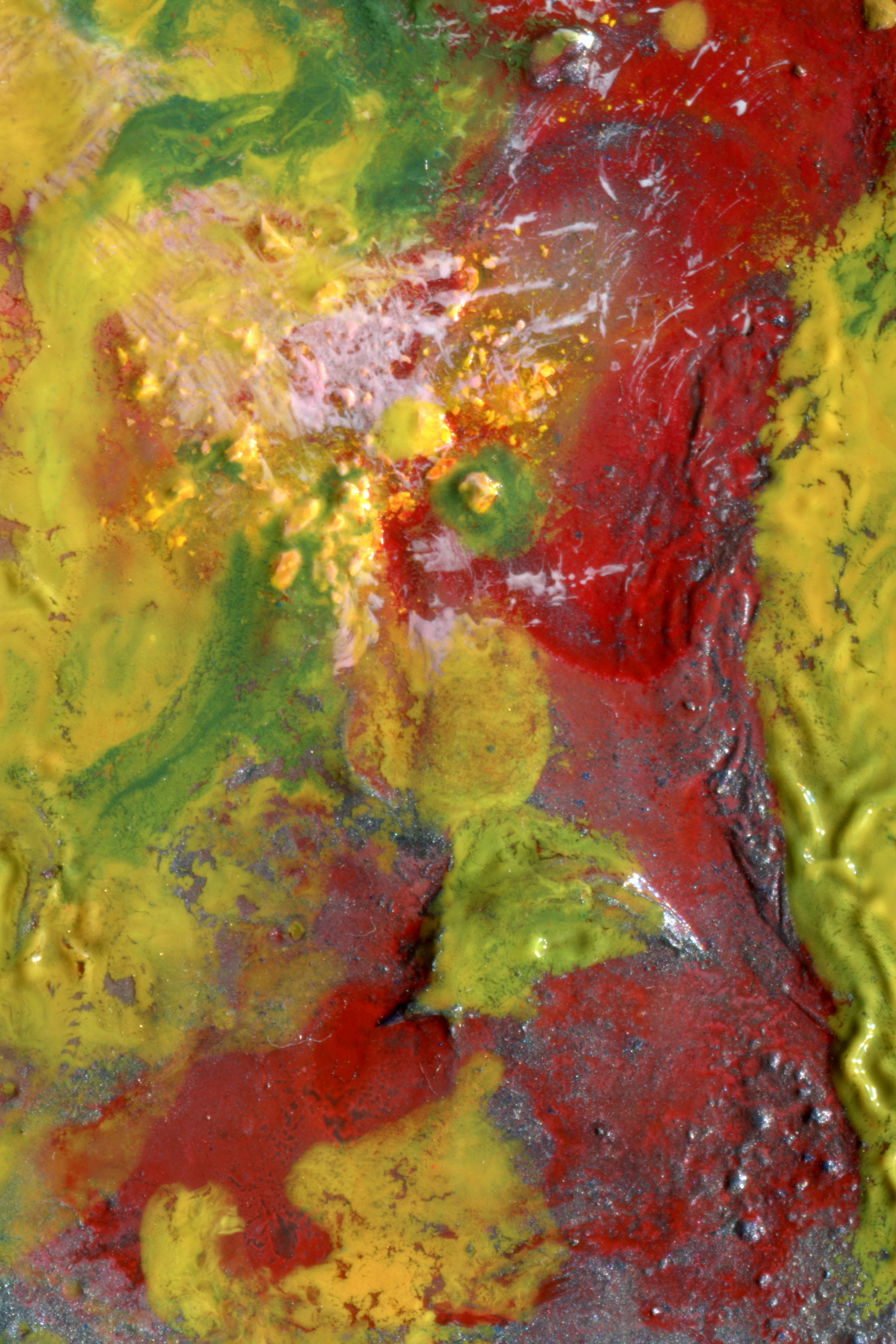 Thick layers of red and yellow oil paint with textured impasto brushstrokes