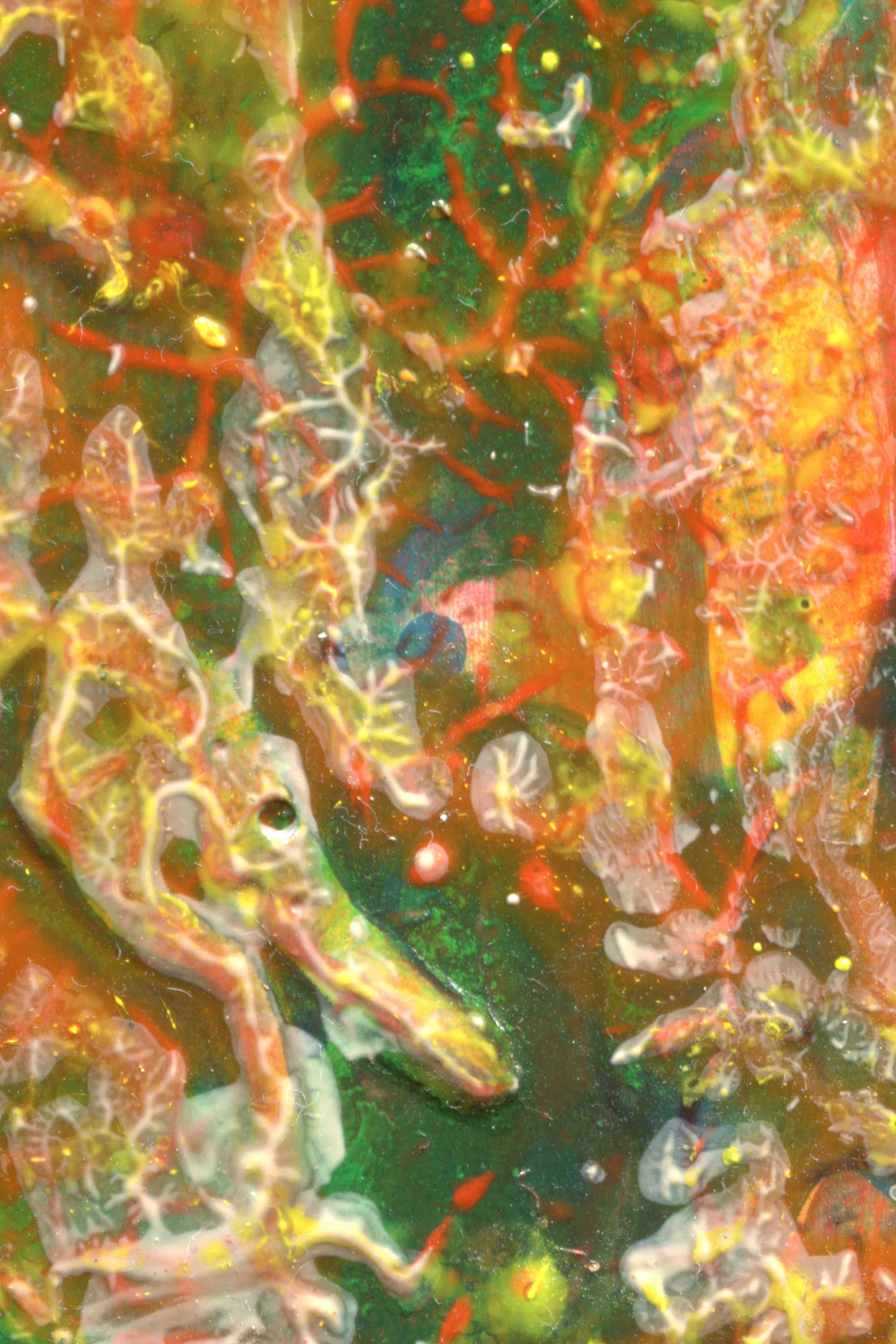 Abstract layers of vibrant green, red, and yellow paint with raised organic textures