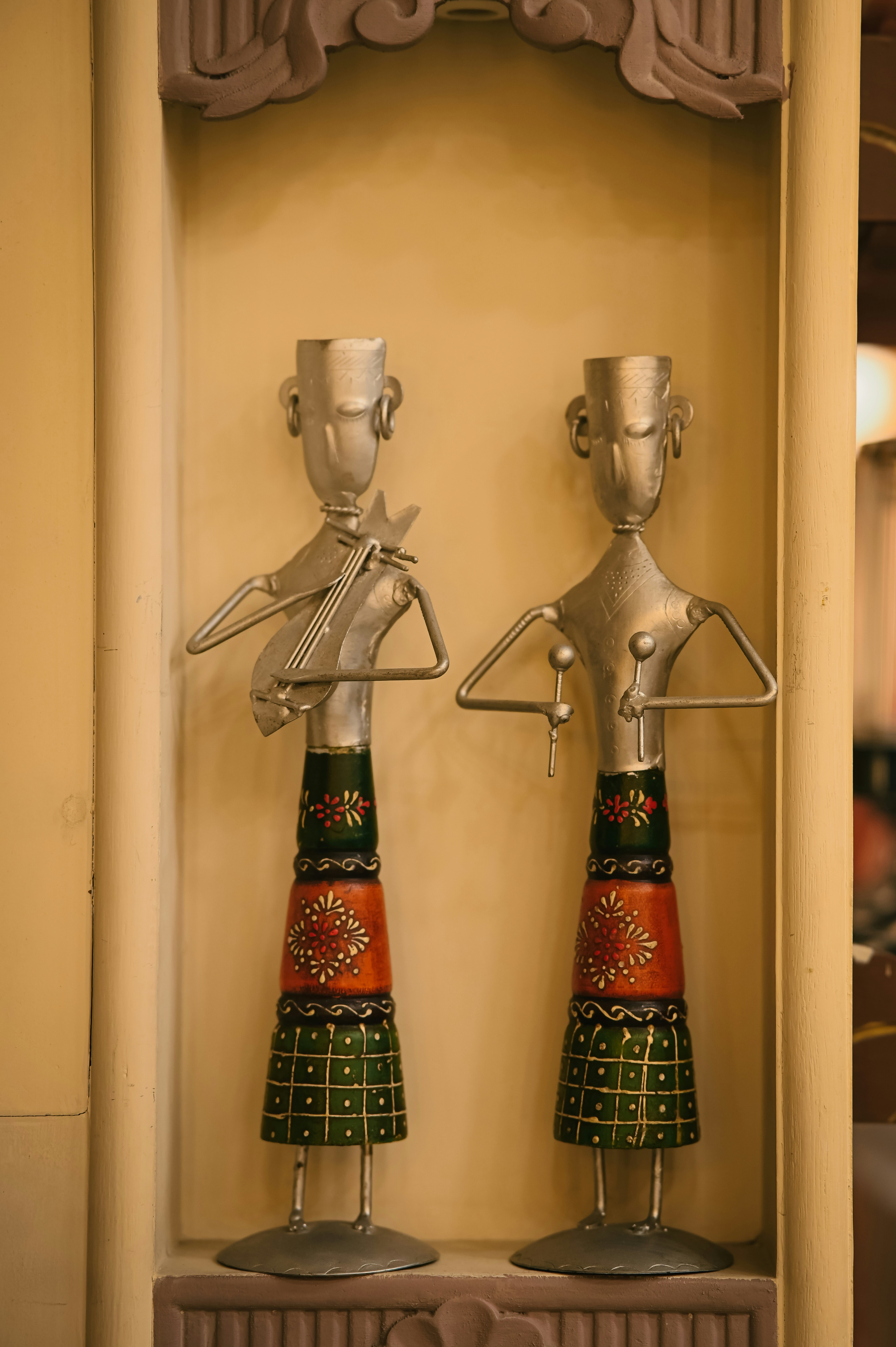Metal musician figurines in wall niche - Free Photo on Unsplash