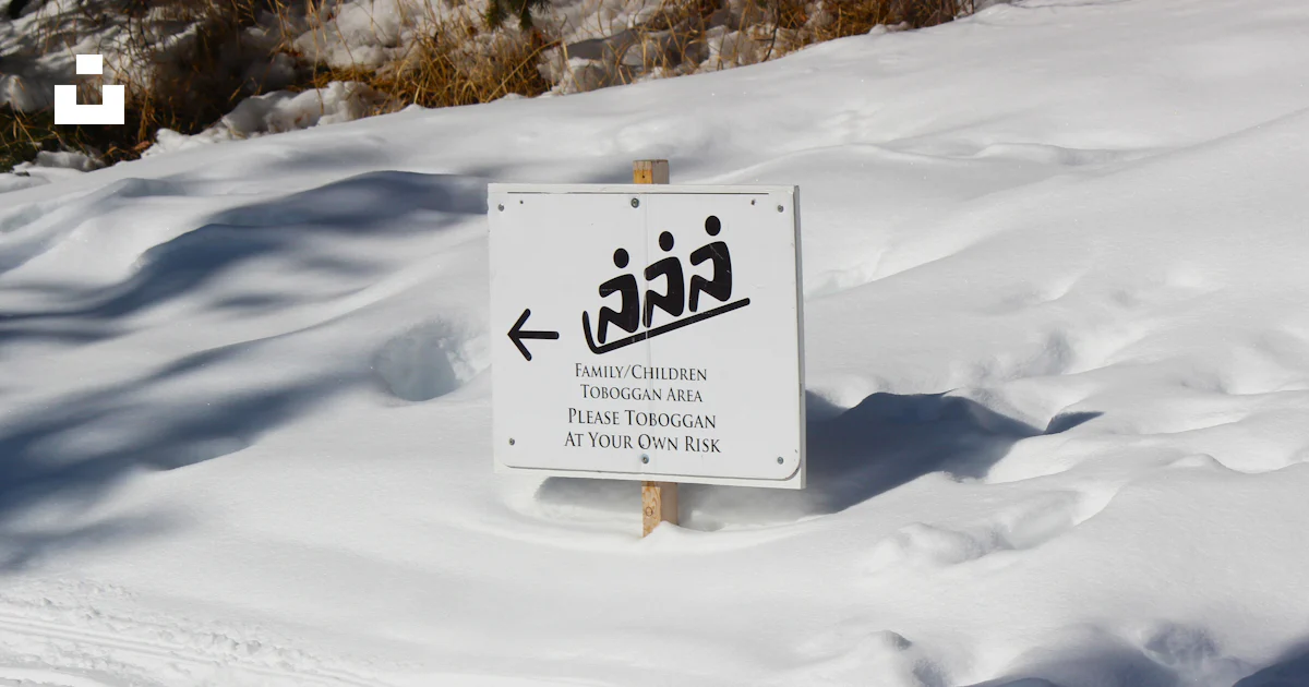 Photograph Risk Management Toboggan area sign in snow - Free Photo on Unsplash