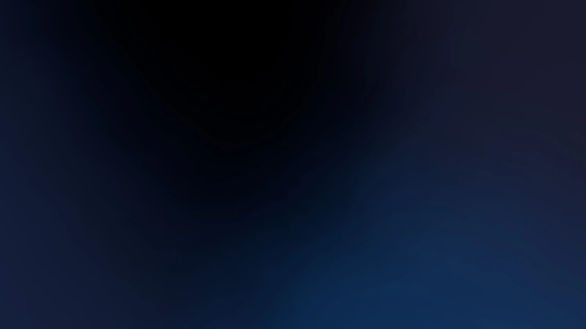 A smooth gradient shifting from deep black to dark blue