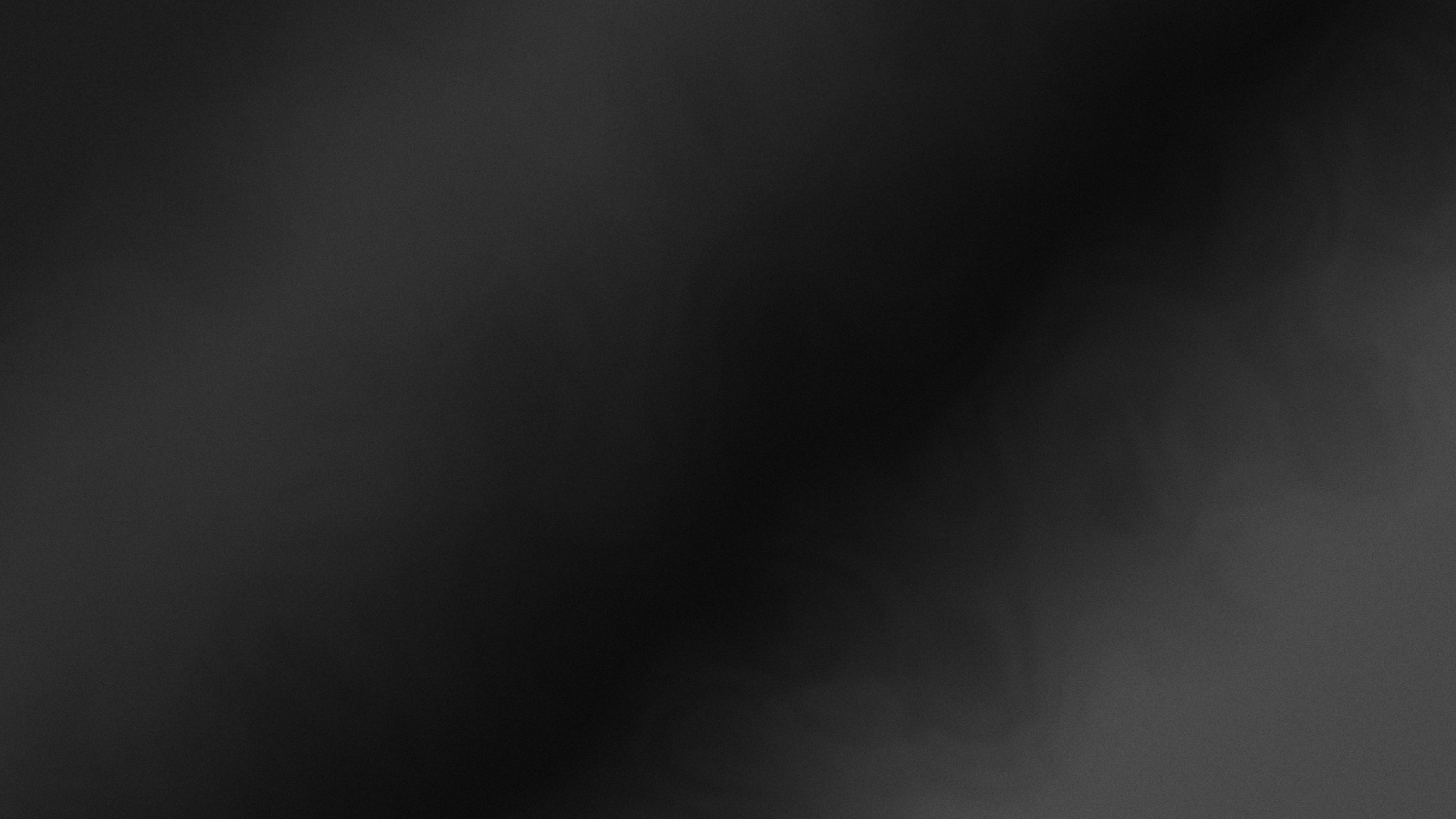 A smooth dark grey gradient with subtle light and shadow