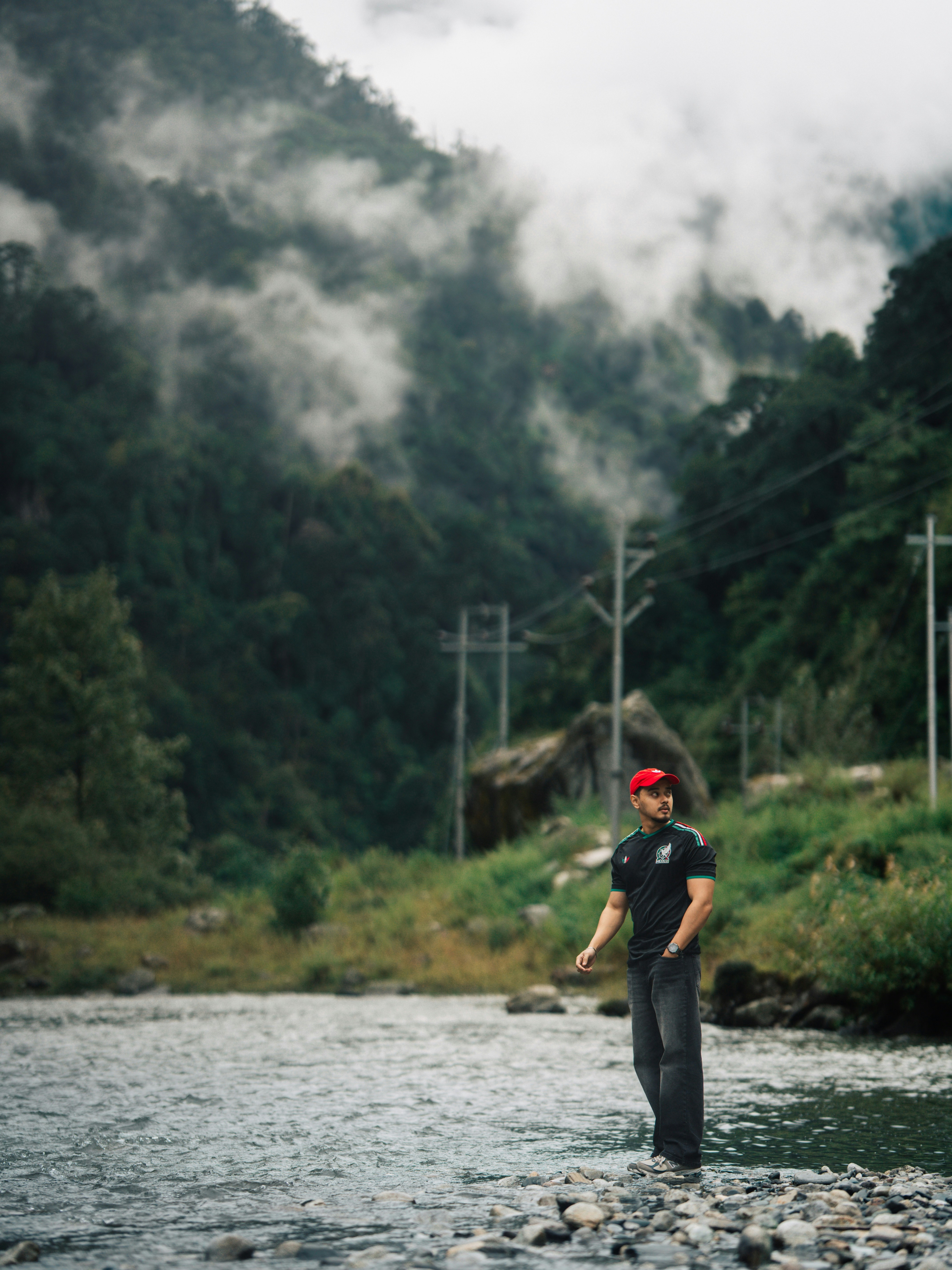 Man in jersey standing in river - Free Photo on Unsplash