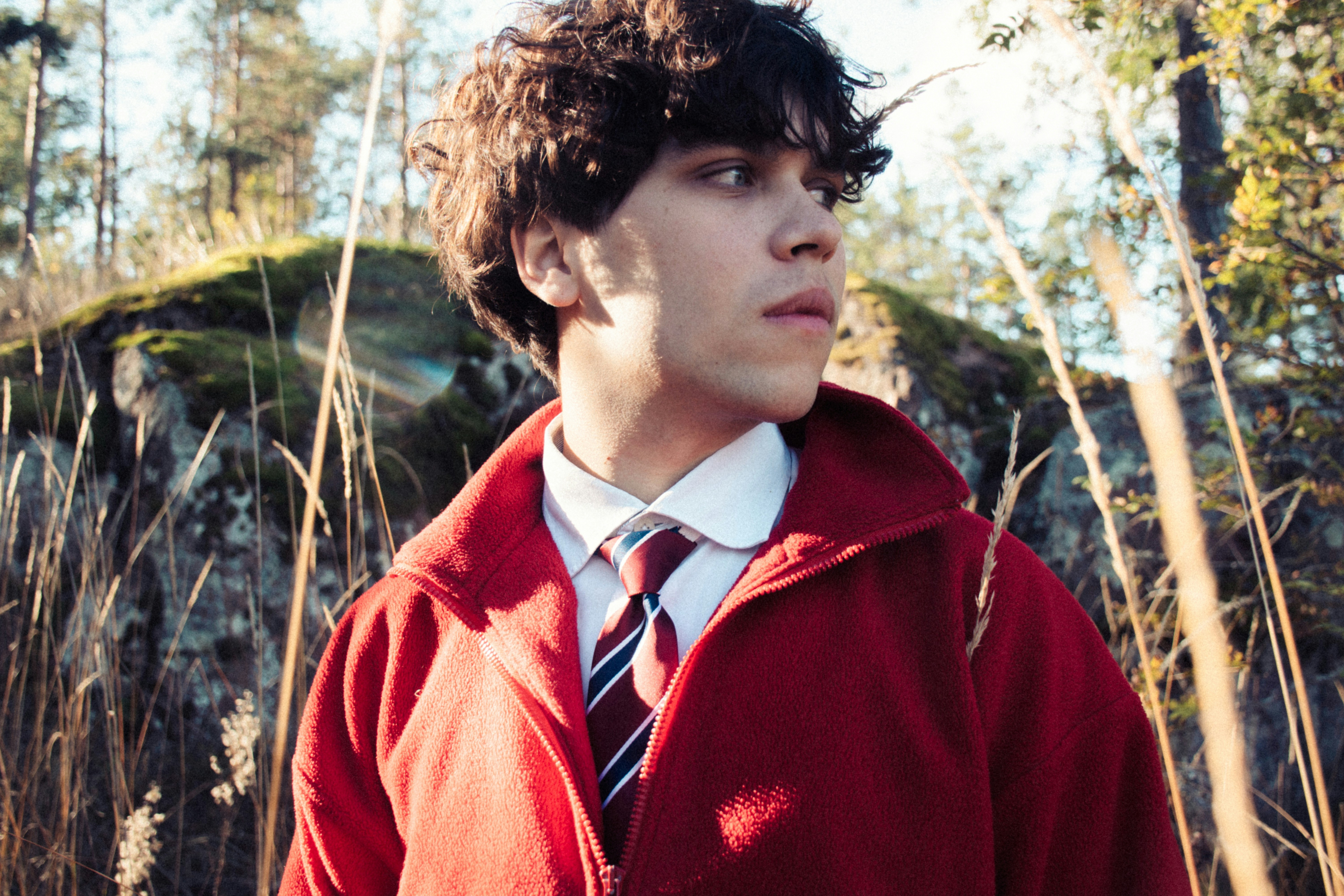 A stylist checking even colour tone on a client's hair after a colour correction at Studio Kin Hair