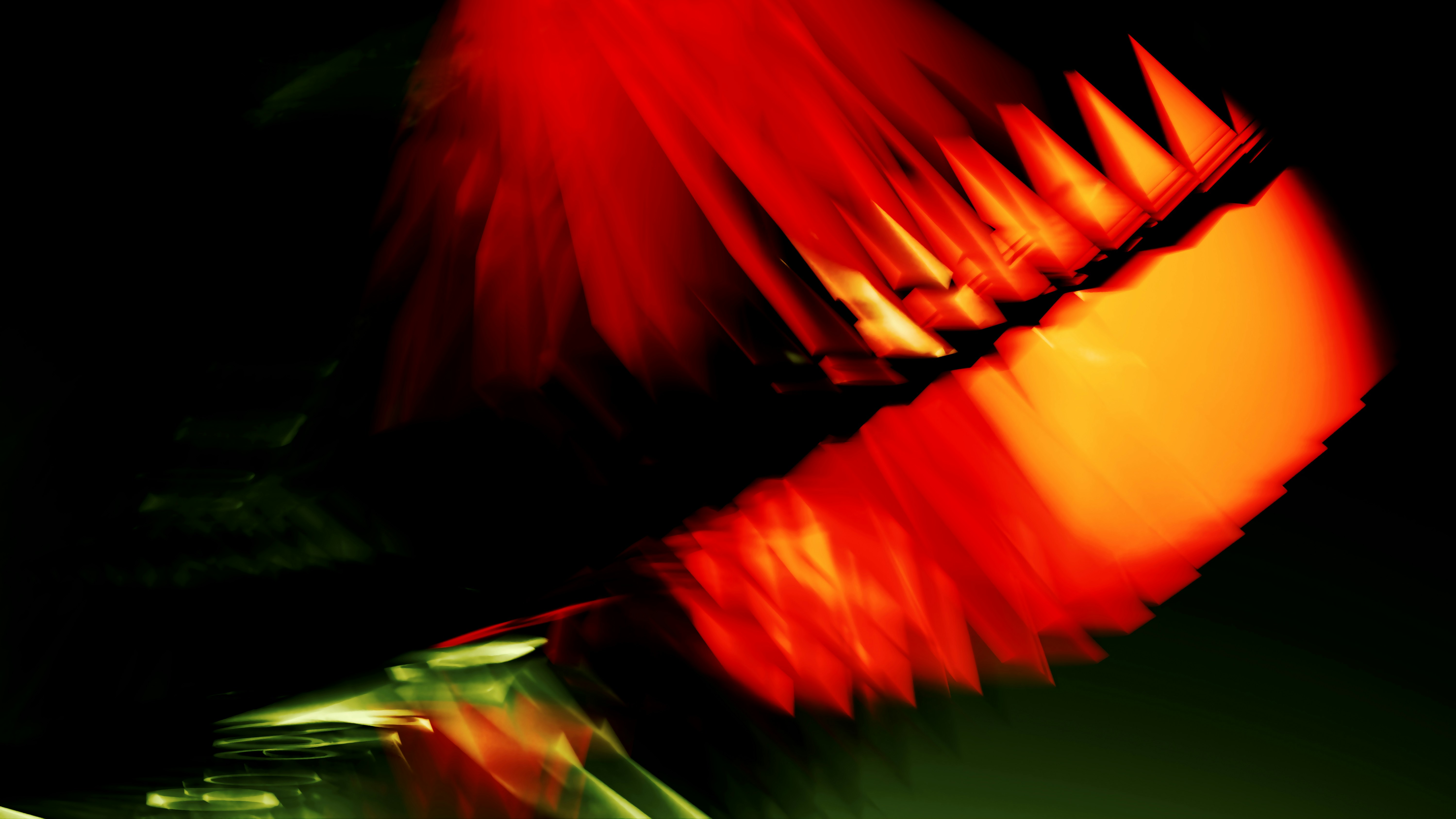 Abstract motion blur of bright red and orange light streaks against a dark background