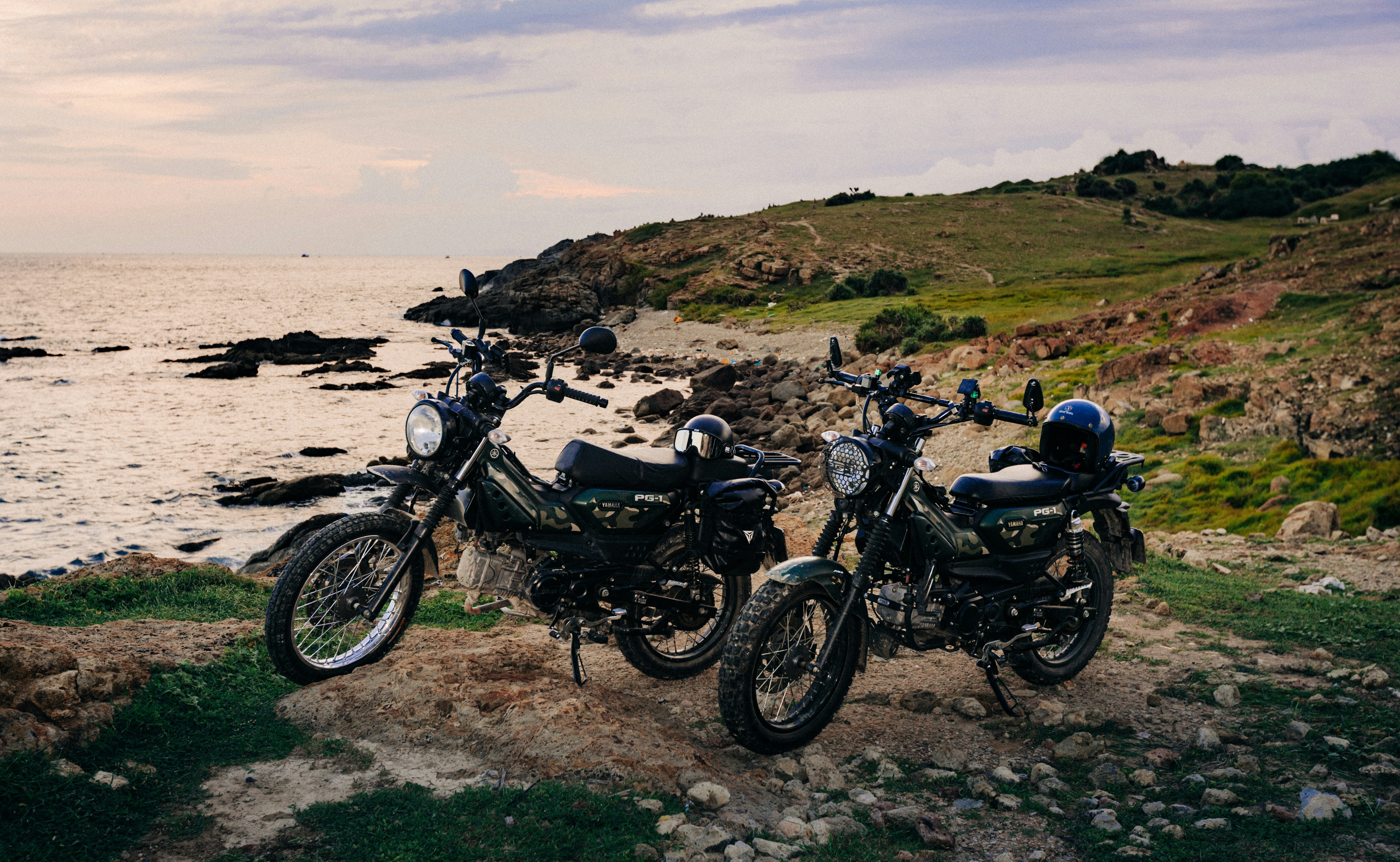 Motorcycles on rocky coastal path - Free Photo on Unsplash