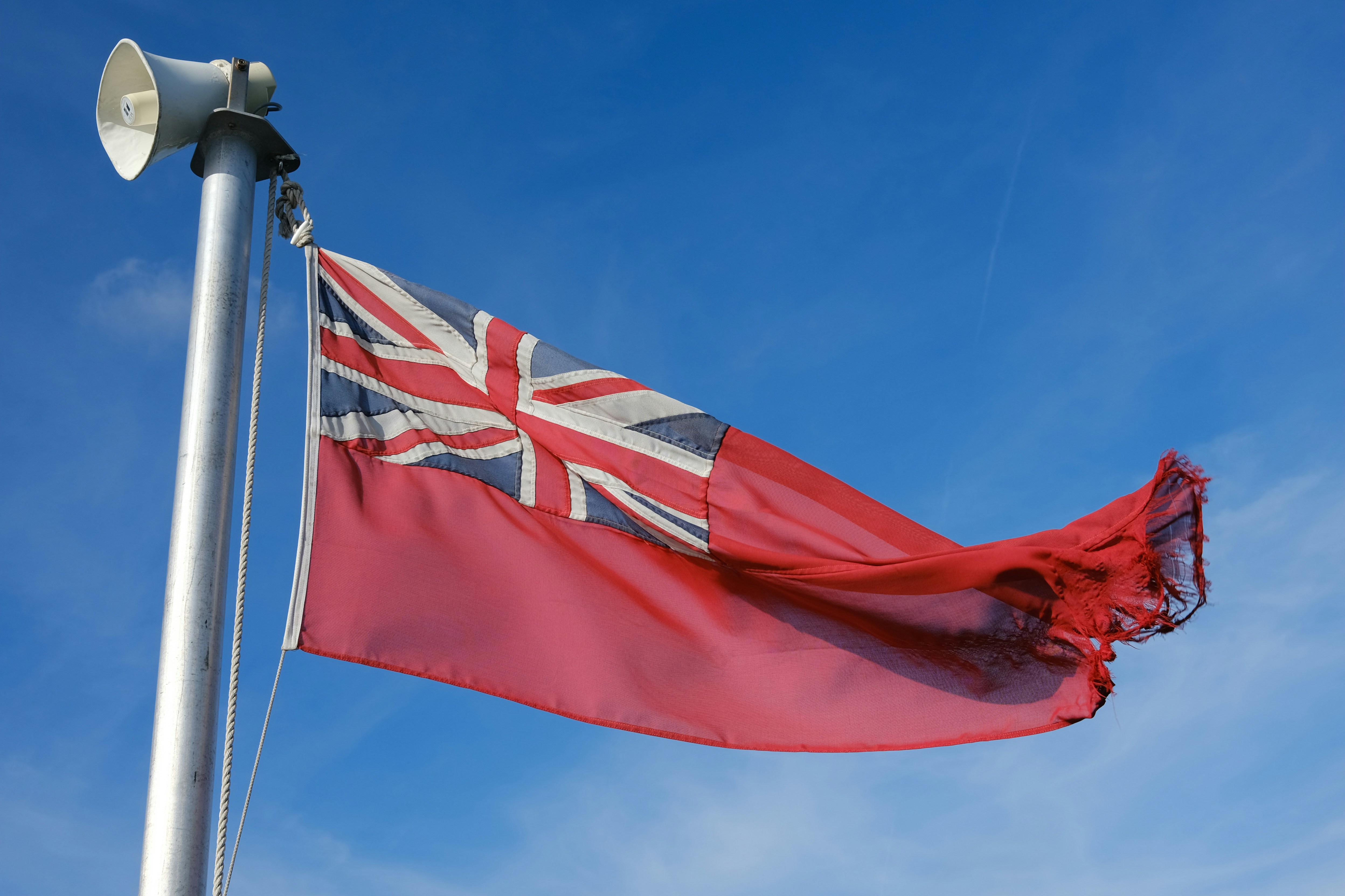 Tattered red ensign flag on pole - Free Photo on Unsplash