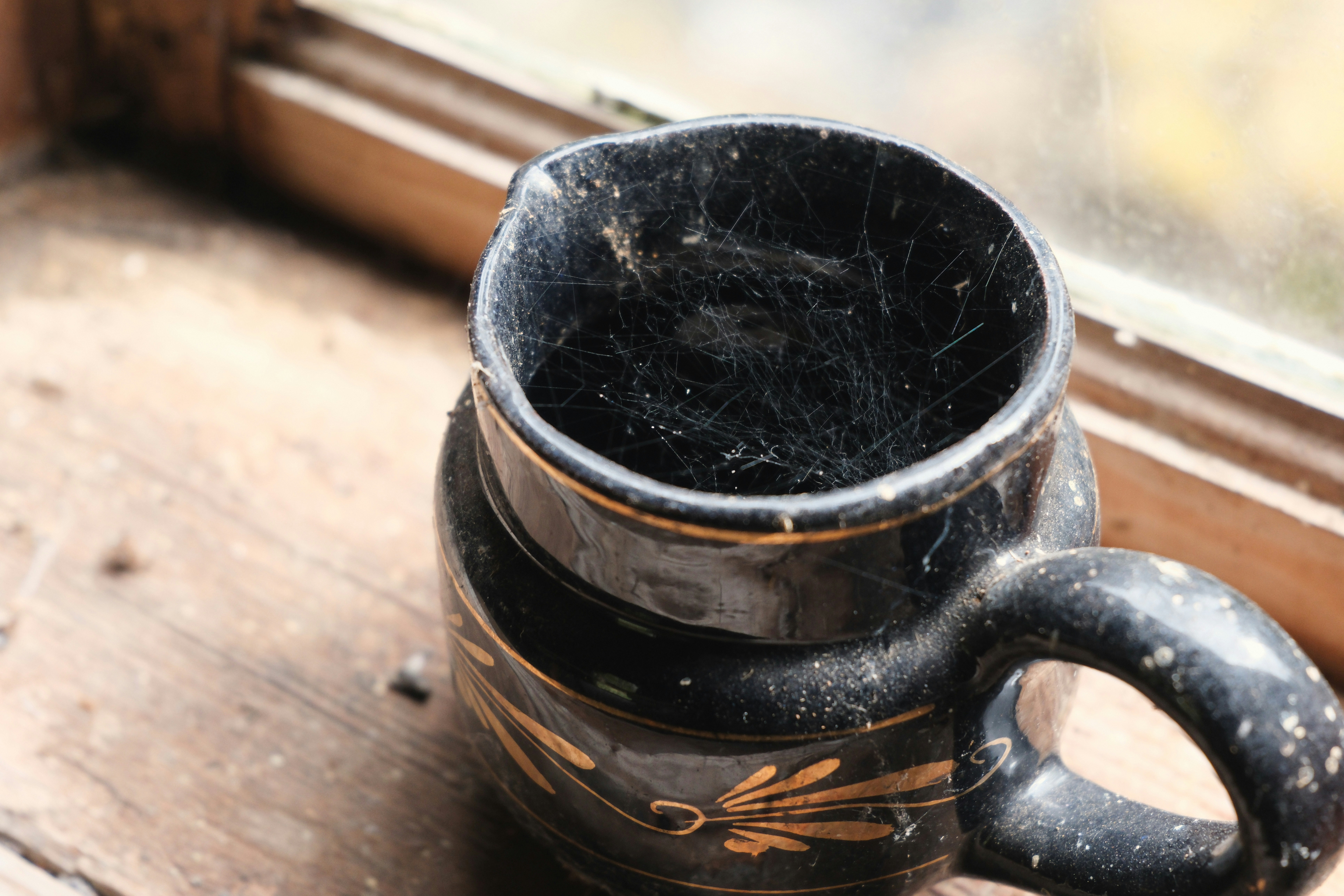 Dusty black pitcher with cobwebs - Free Photo on Unsplash