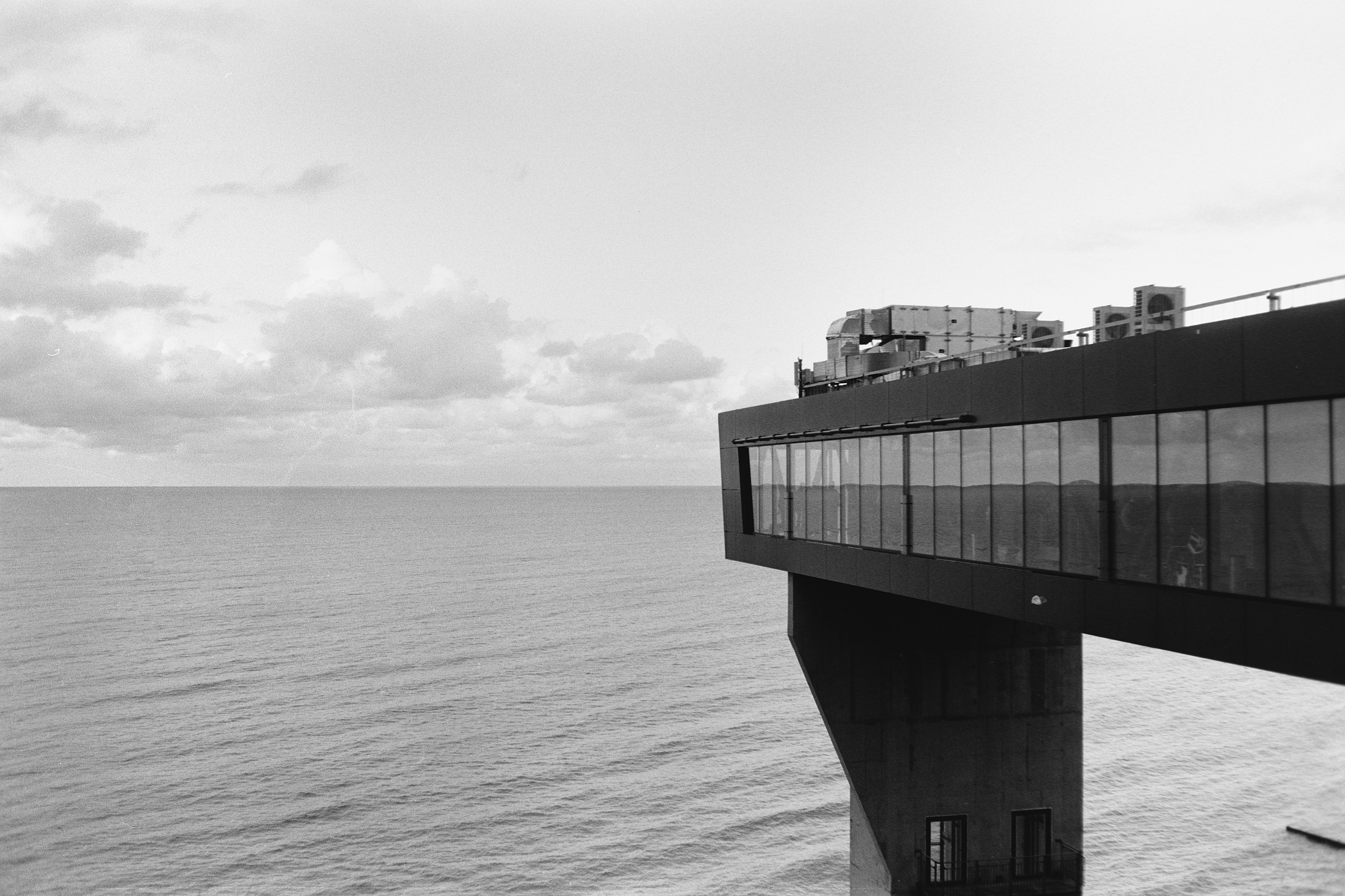 Modern cantilevered building over sea - Free Photo on Unsplash