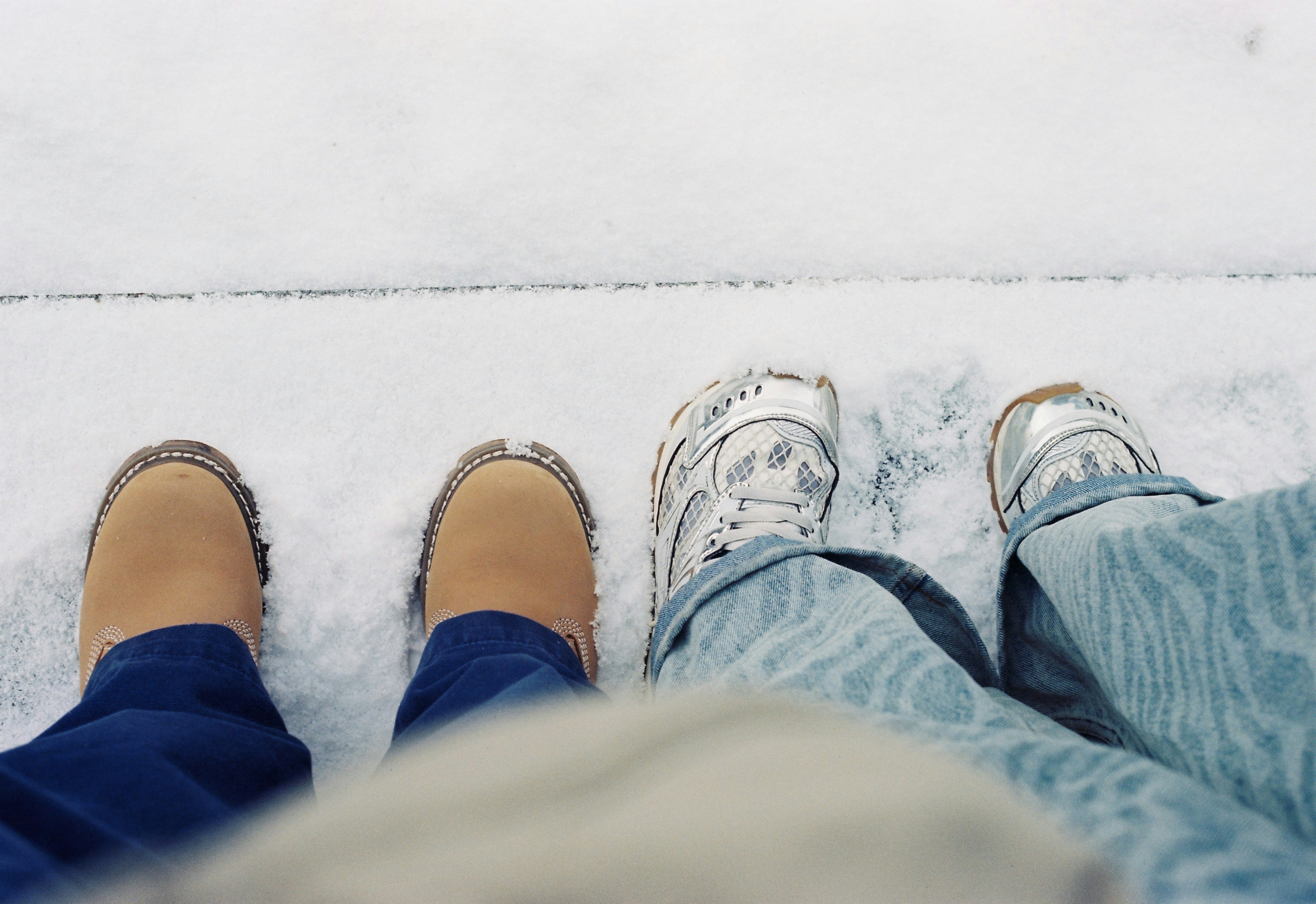 Feet in boots and sneakers - Free Photo on Unsplash