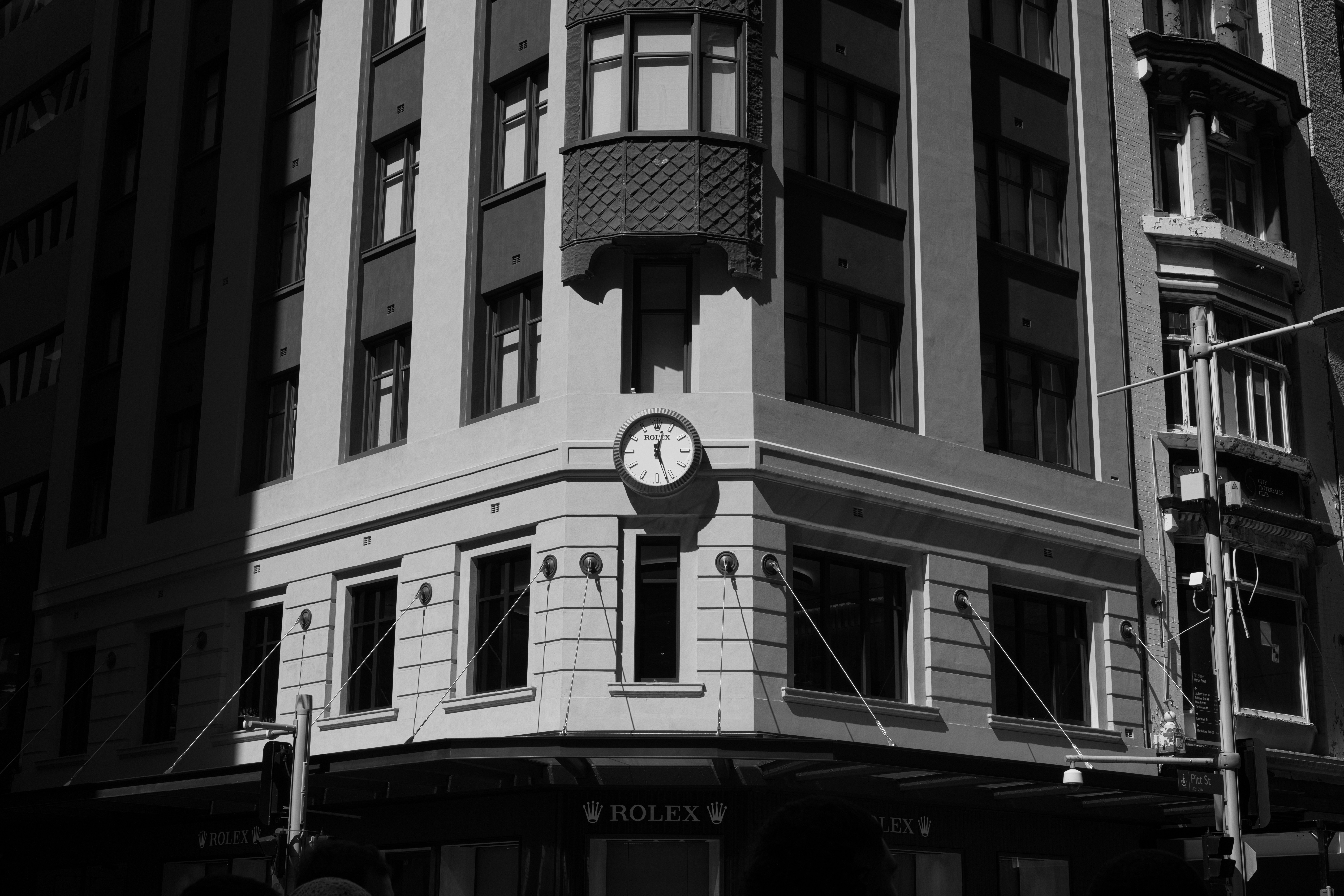Corner building with Rolex clock - Free Photo on Unsplash