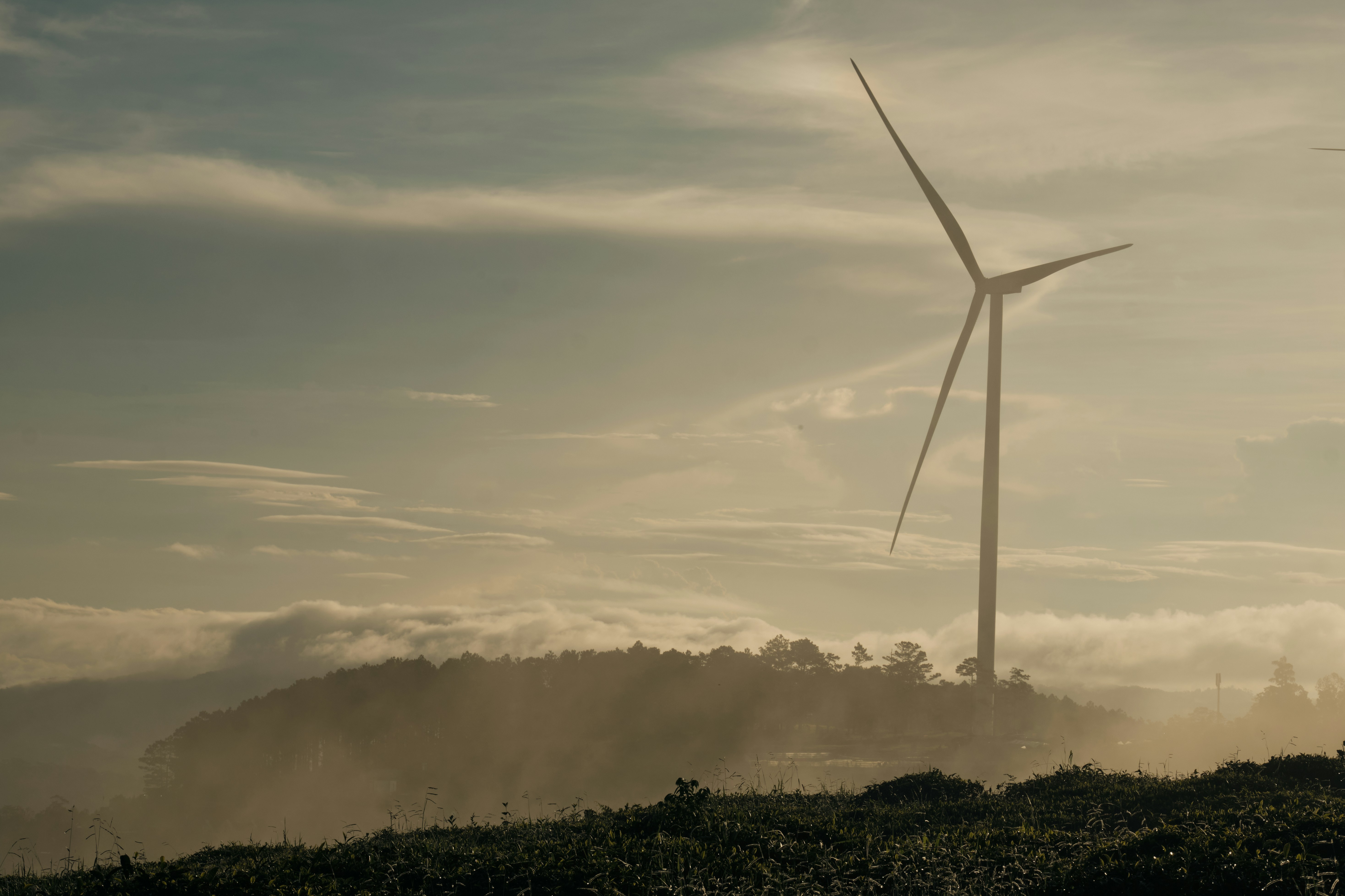 Wind turbine in misty landscape - Free Photo on Unsplash
