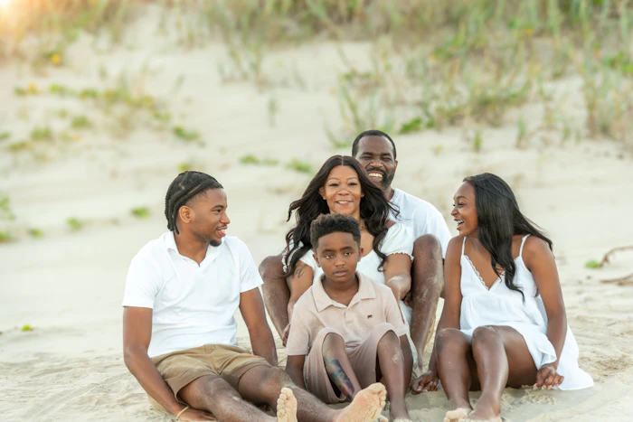 Family relaxing on the beach