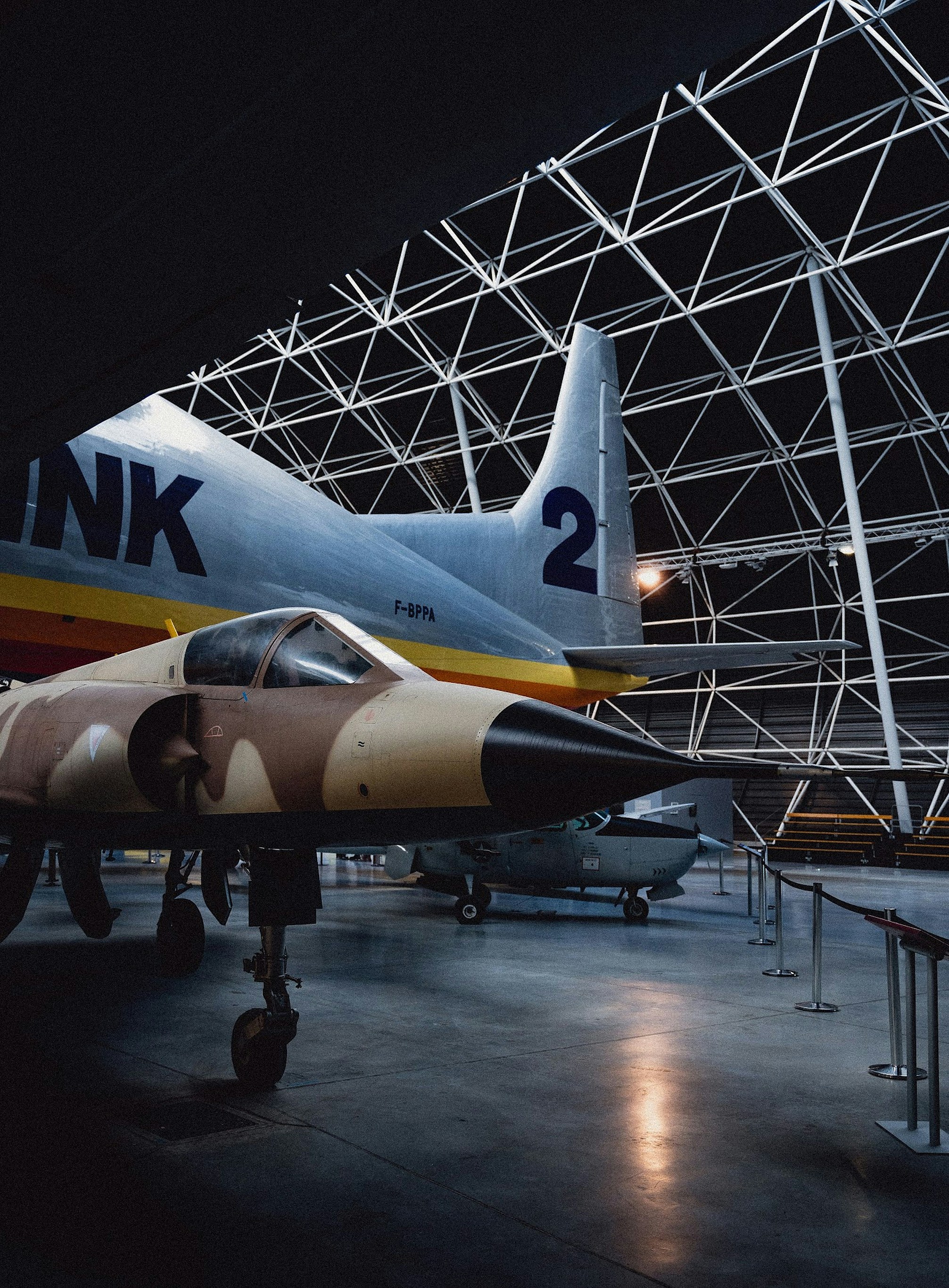 Camouflage fighter jet in hangar - Free Photo on Unsplash
