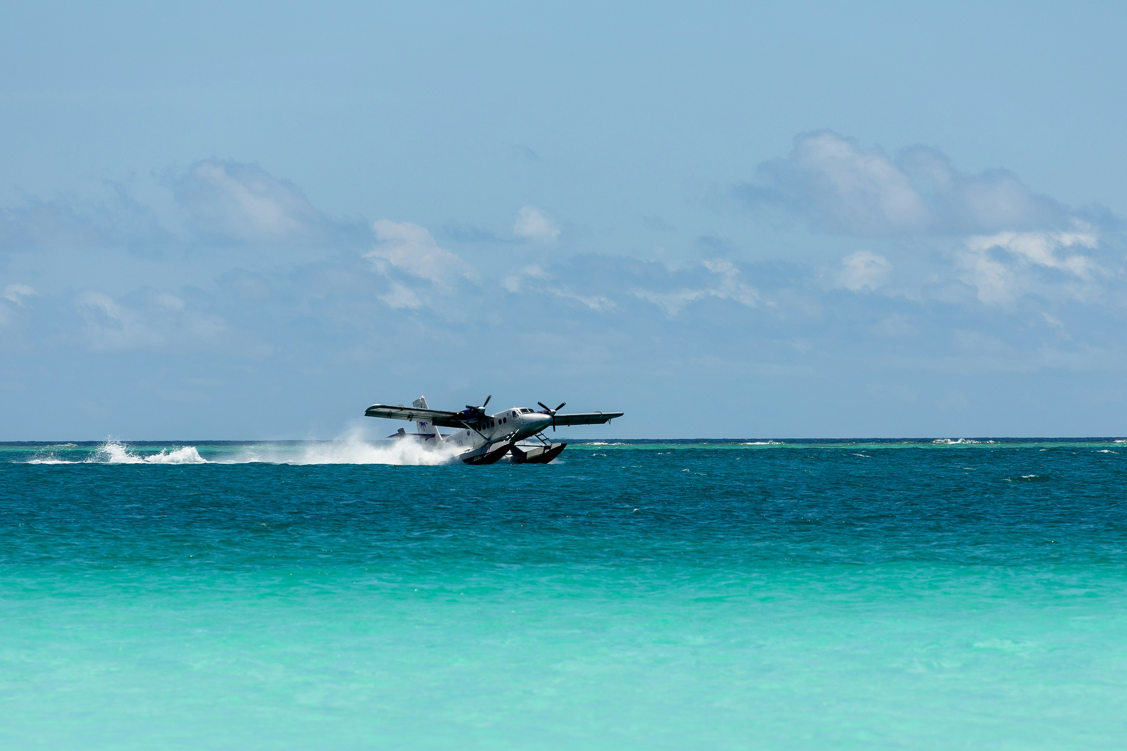Seaplane taking off from tropical water - Free Photo on Unsplash