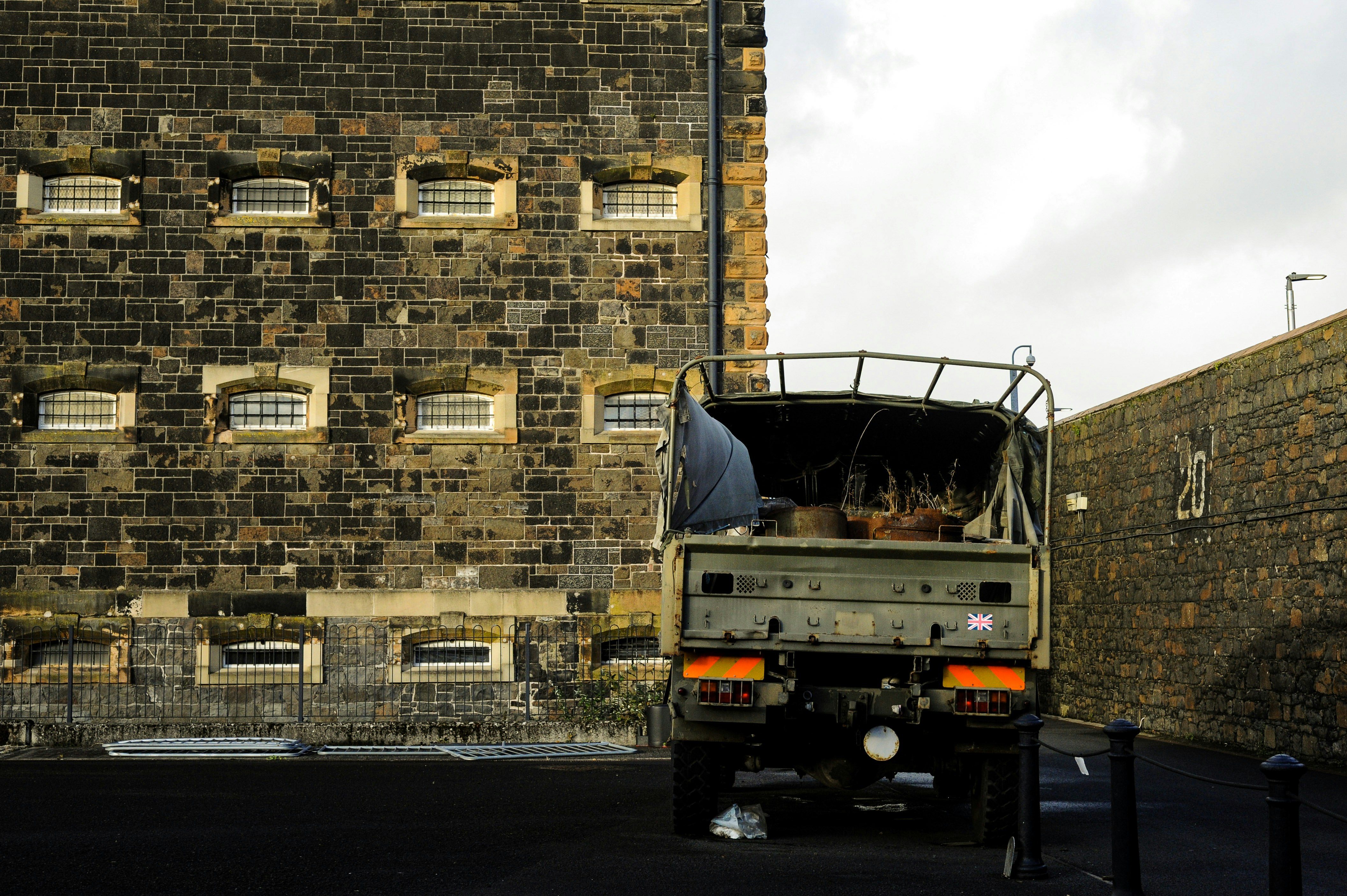 Military truck beside stone building - Free Photo on Unsplash