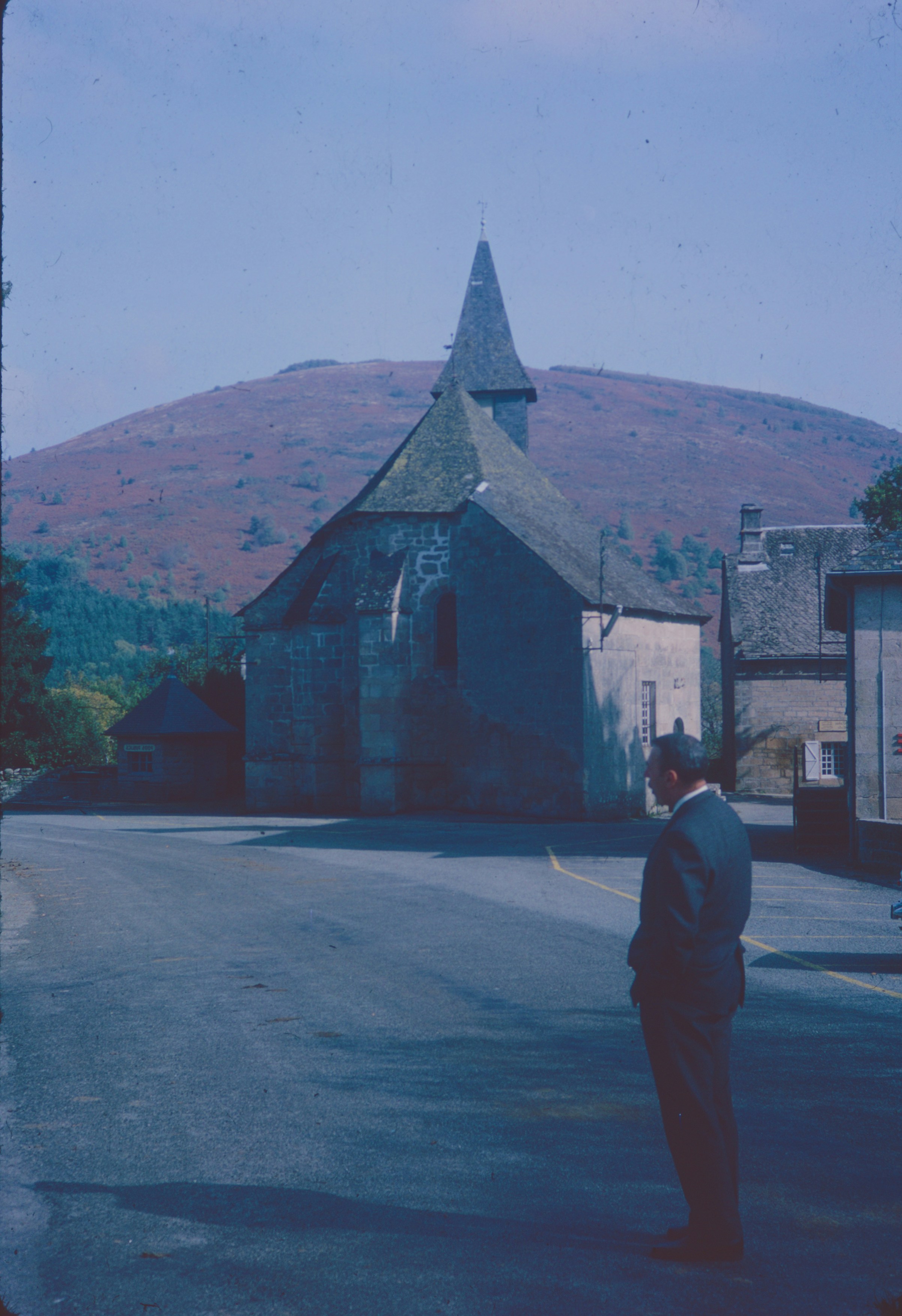 Man in suit before stone church - Free Photo on Unsplash