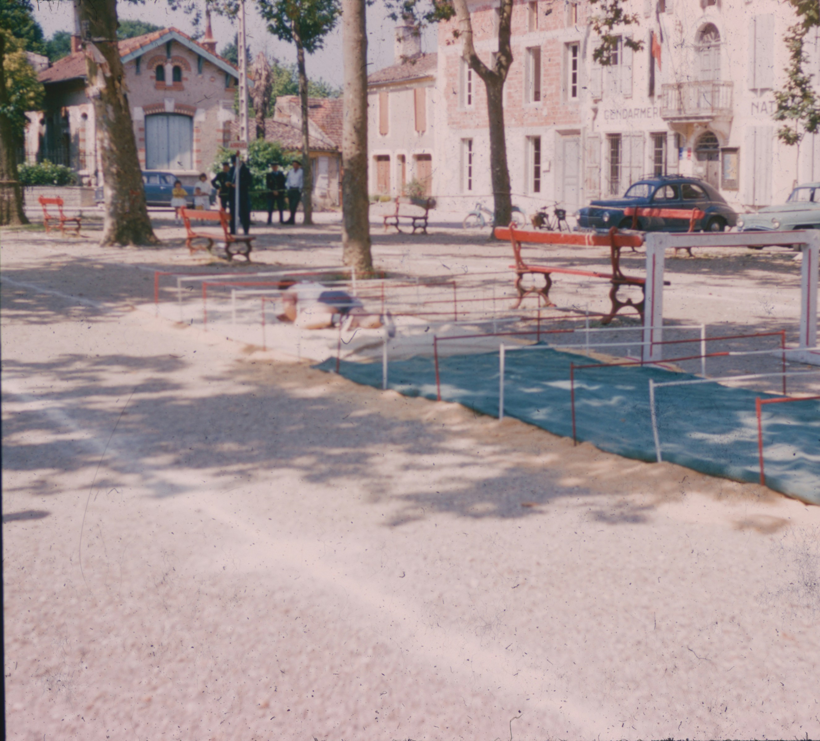 Person crawling through town square obstacle - Free Photo on Unsplash