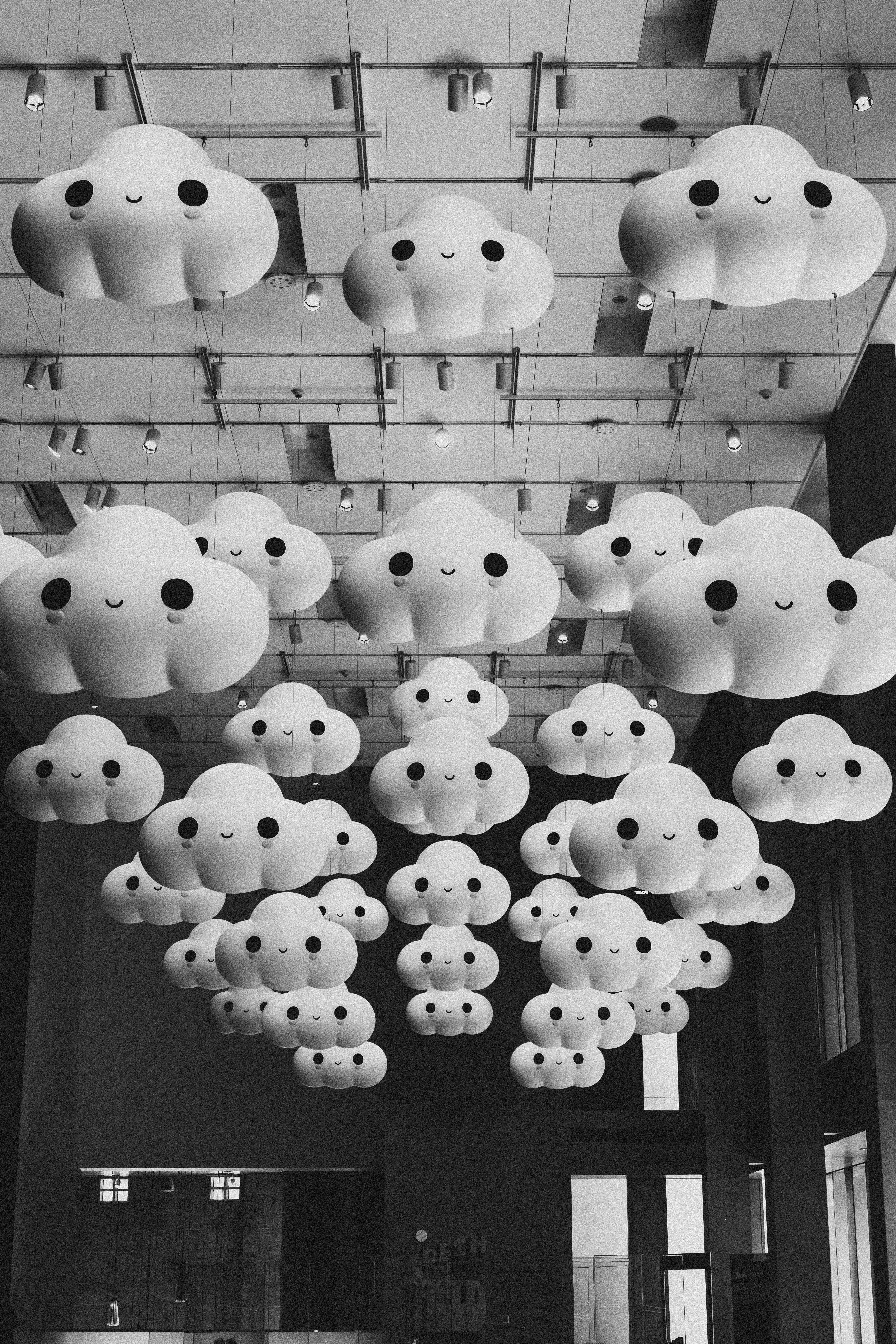 Smiling cloud pendant lights on ceiling - Free Photo on Unsplash