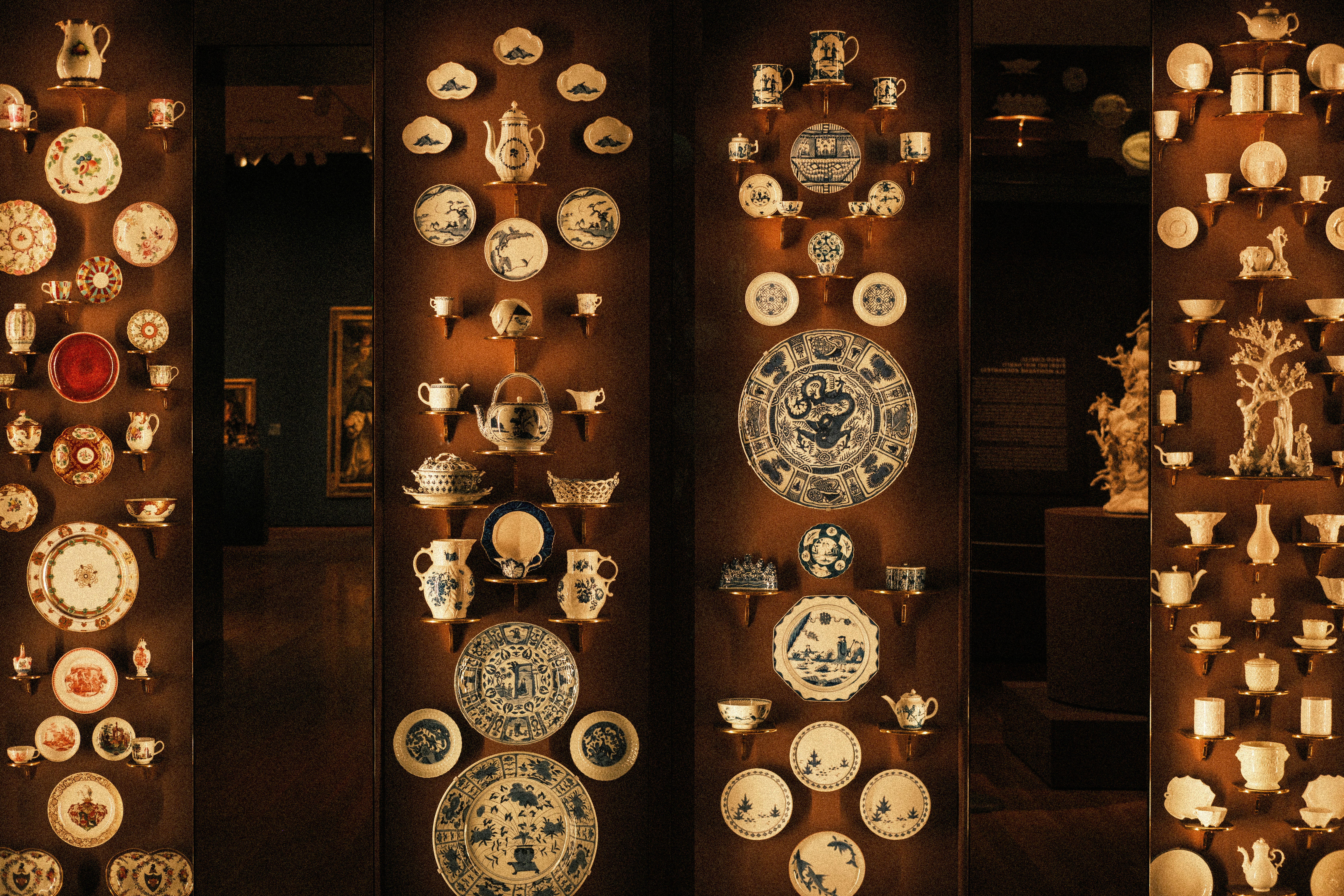 Antique ceramic collection on museum shelves - Free Photo on Unsplash