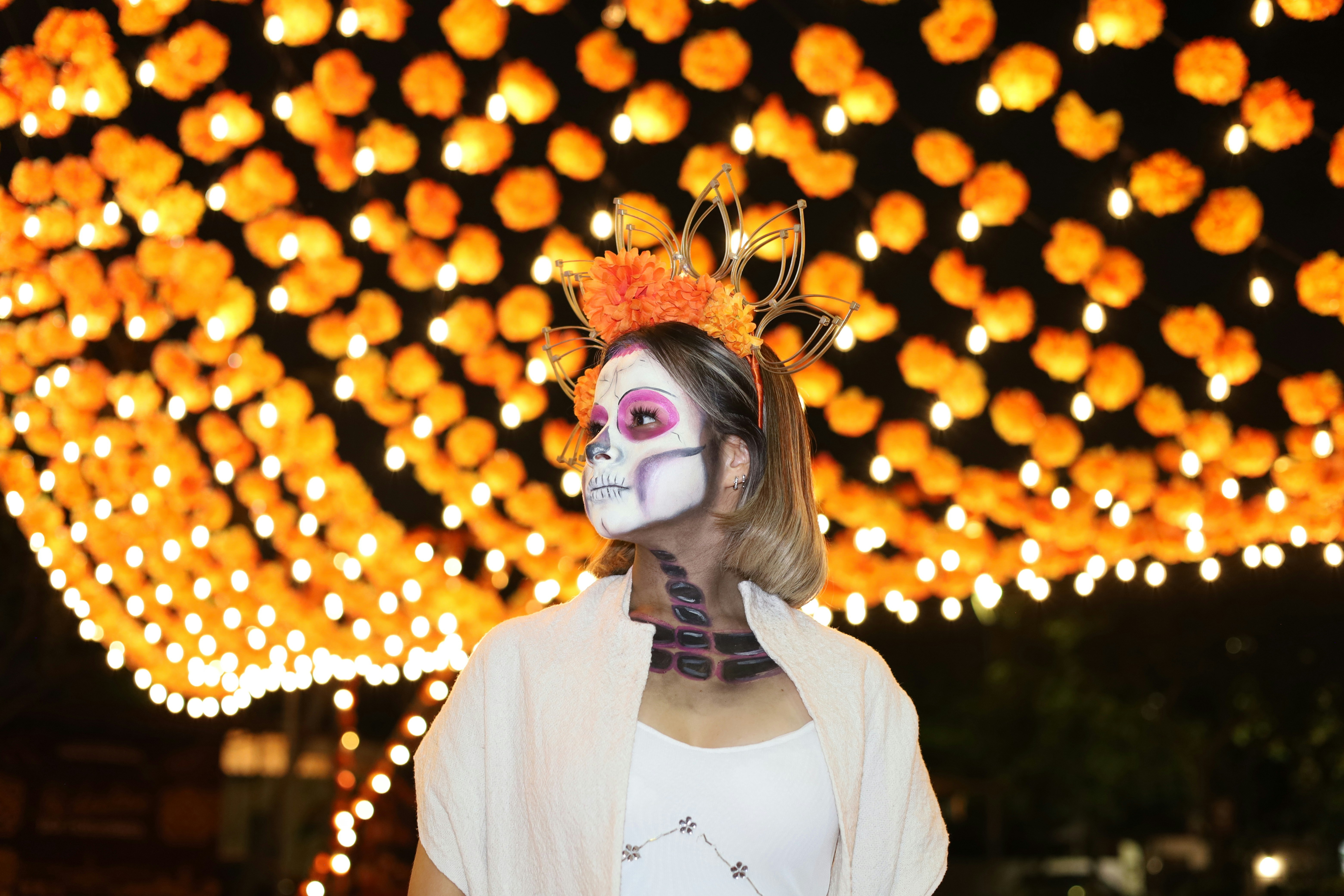 Person with skull makeup under lights - Free Photo on Unsplash