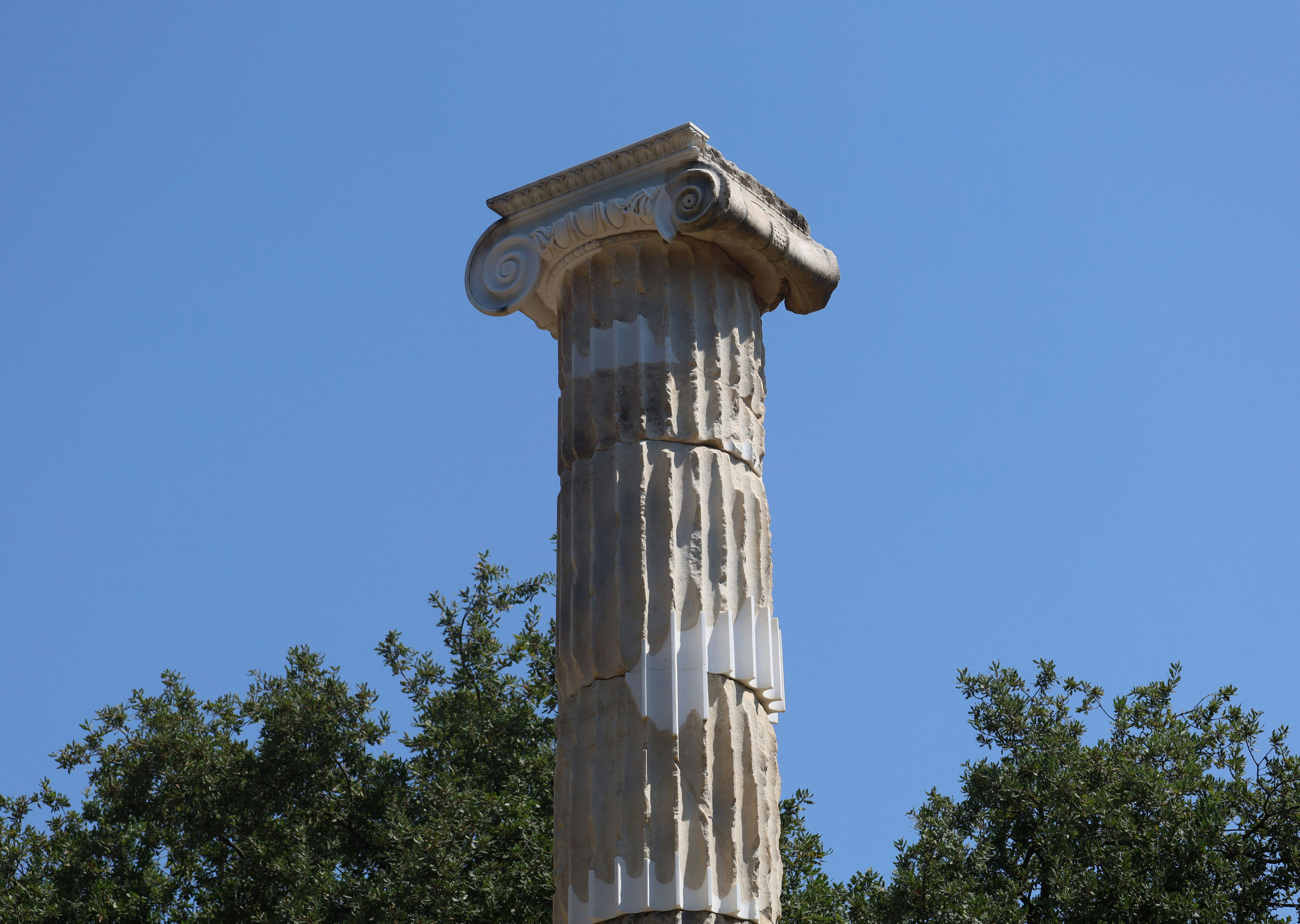 Weathered ionic column against blue sky - Free Photo on Unsplash