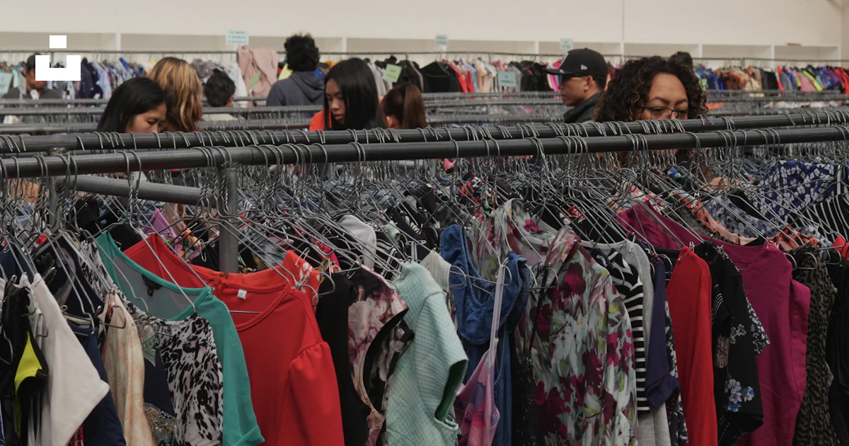 Alpha Textile Jacket People browsing clothing in thrift store - Free Photo on Unsplash