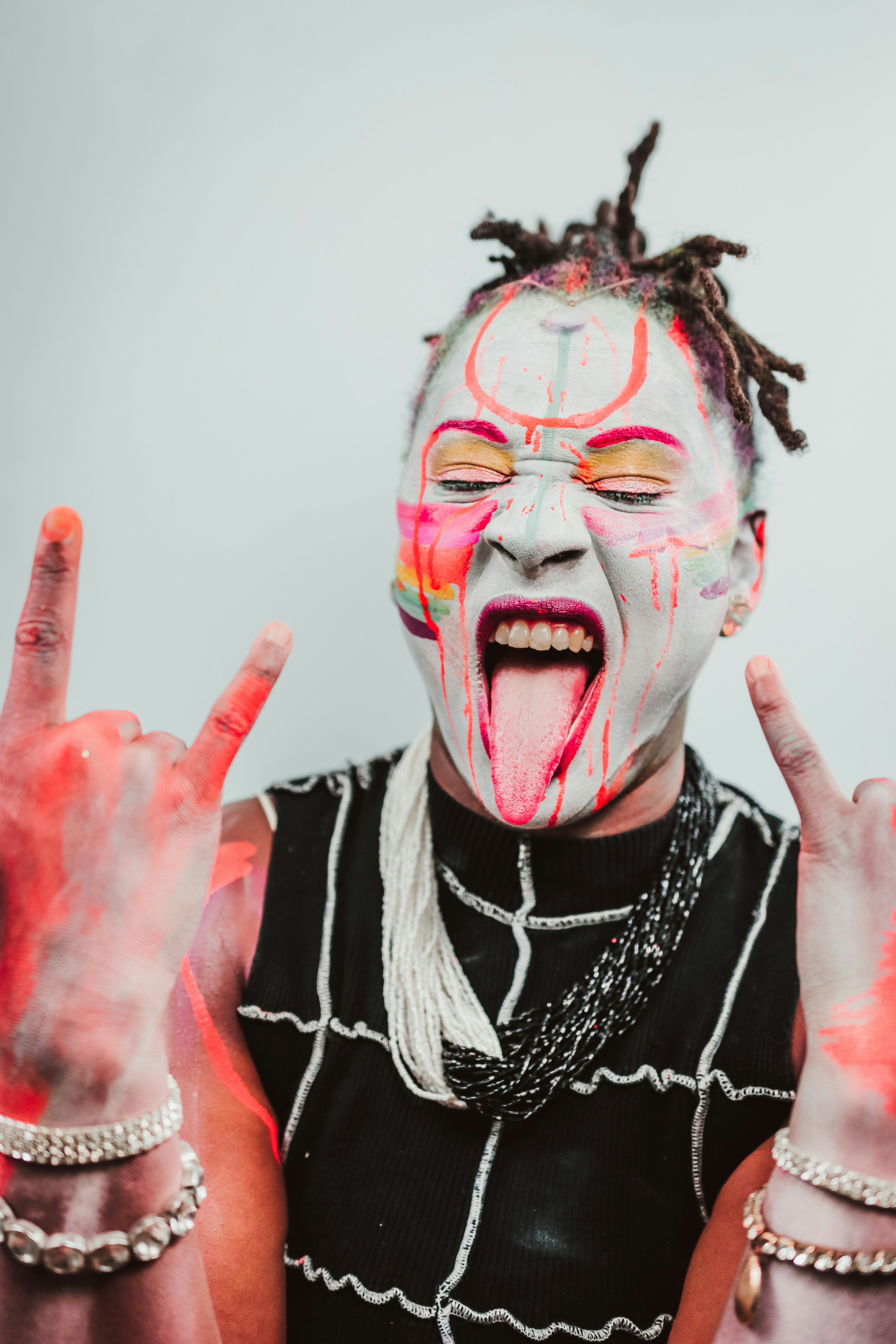Person with face paint making gesture - Free Photo on Unsplash