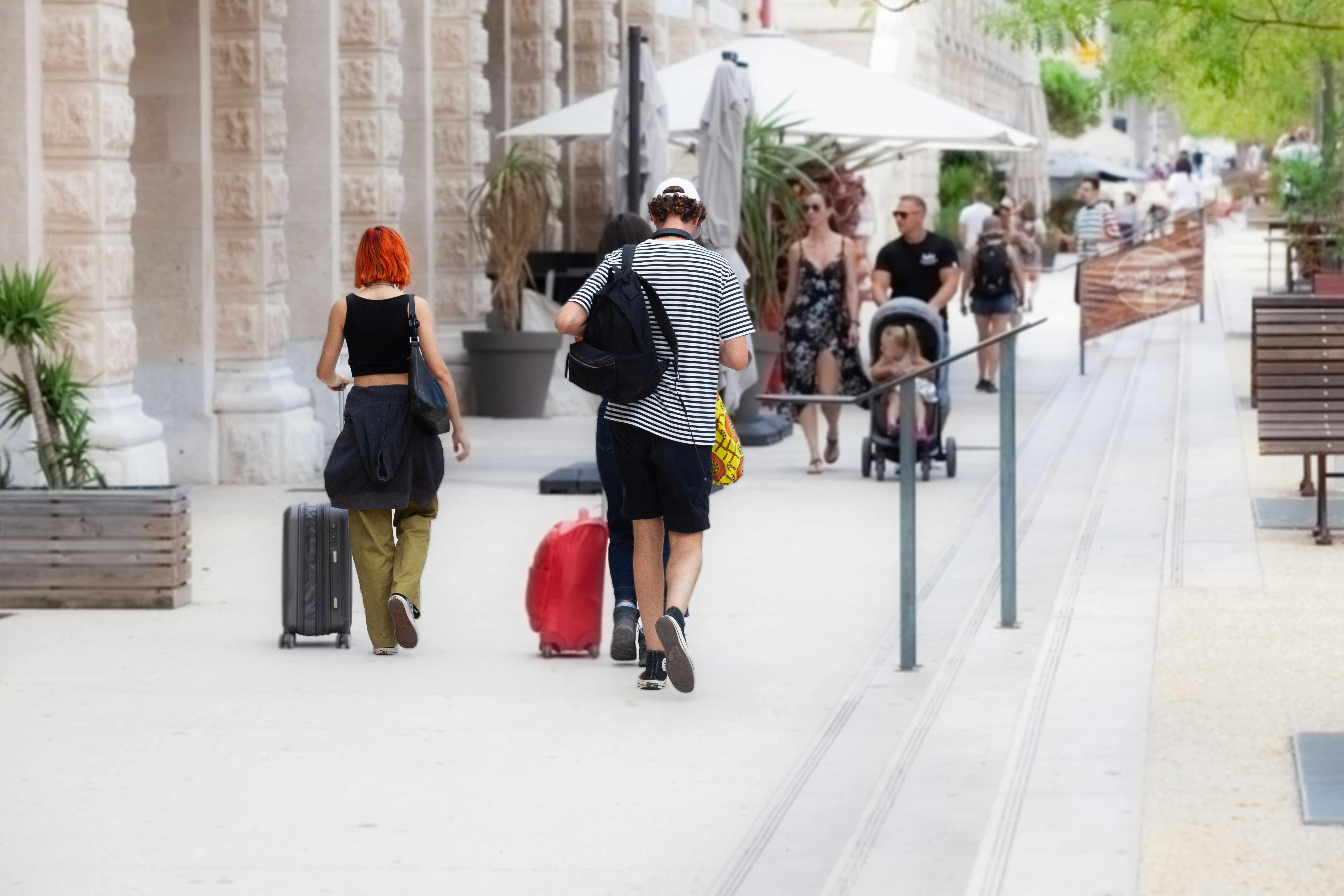 Travellers walking with their luggage