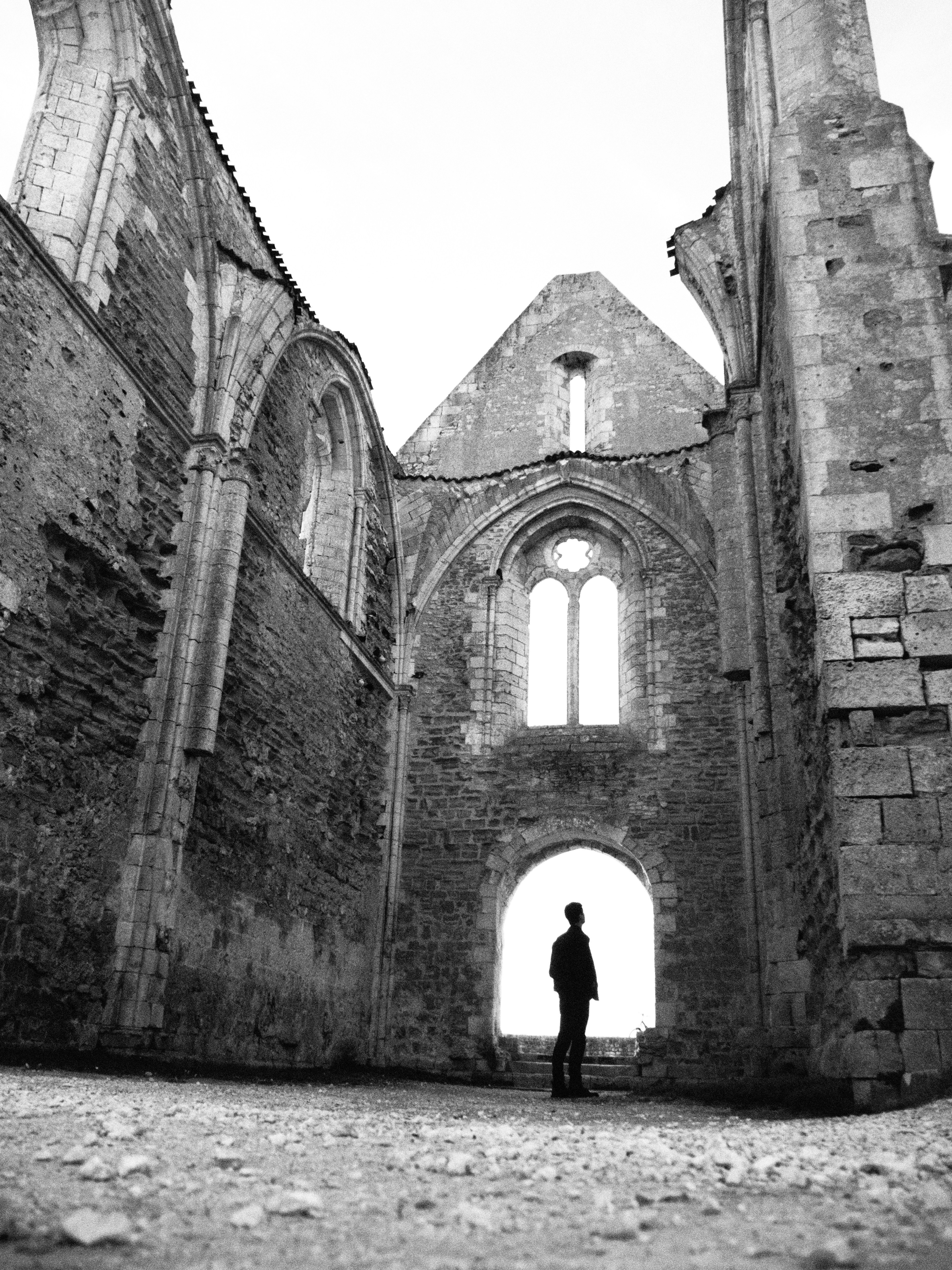 Person in silhouette in stone ruins - Free Photo on Unsplash