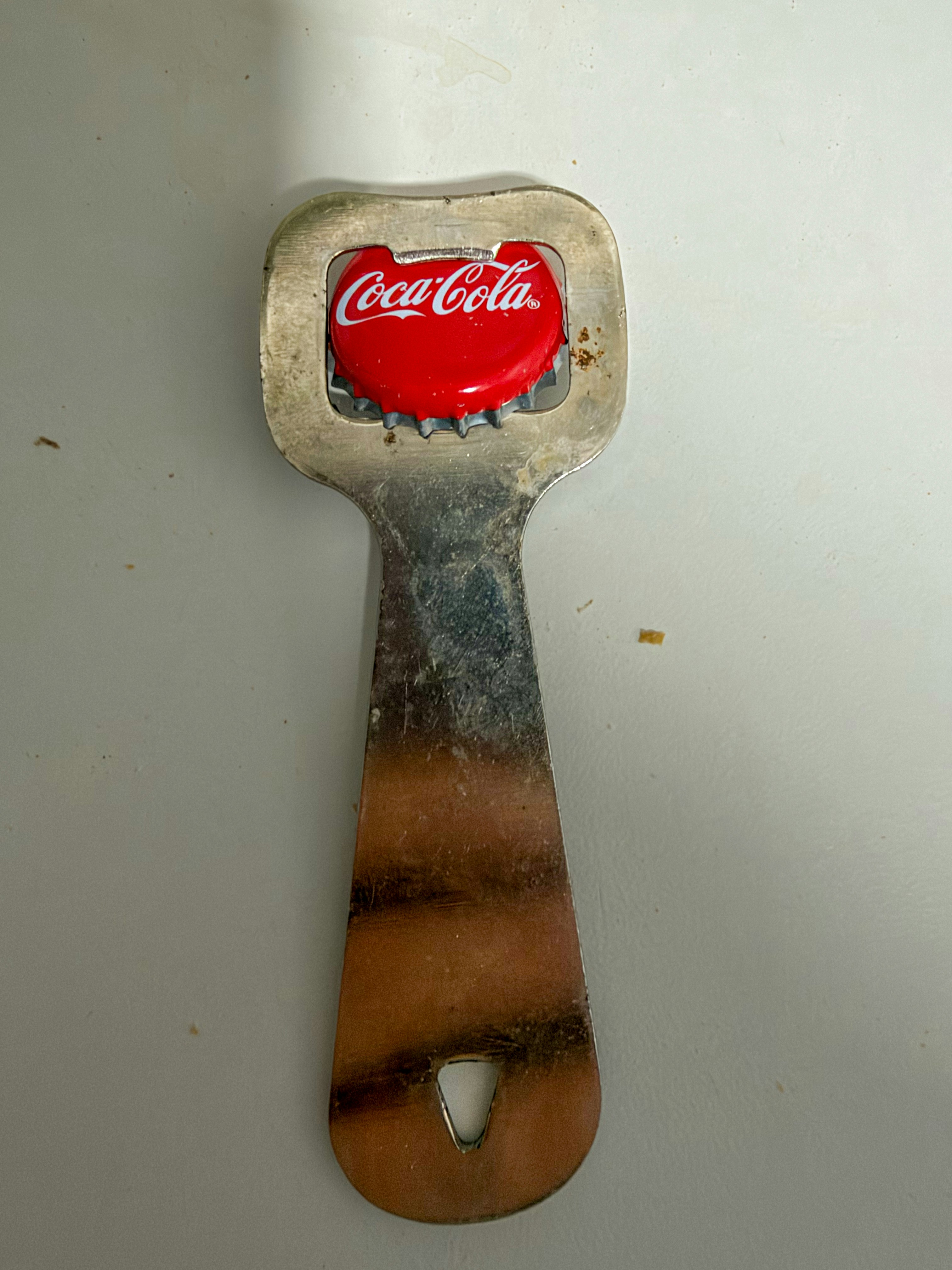 Metal bottle opener with Coca-Cola cap - Free Photo on Unsplash