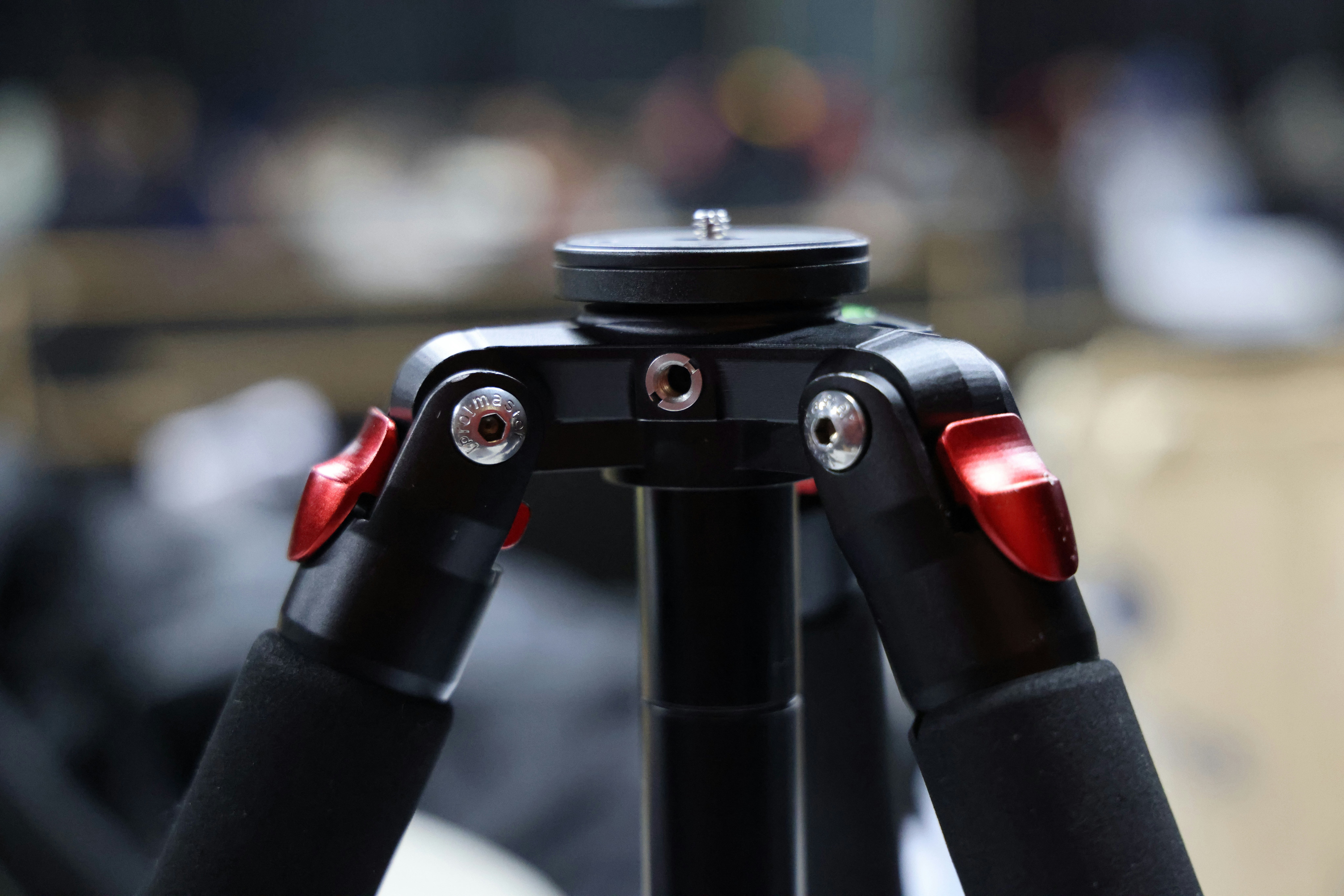 Black camera tripod with red levers - Free Photo on Unsplash