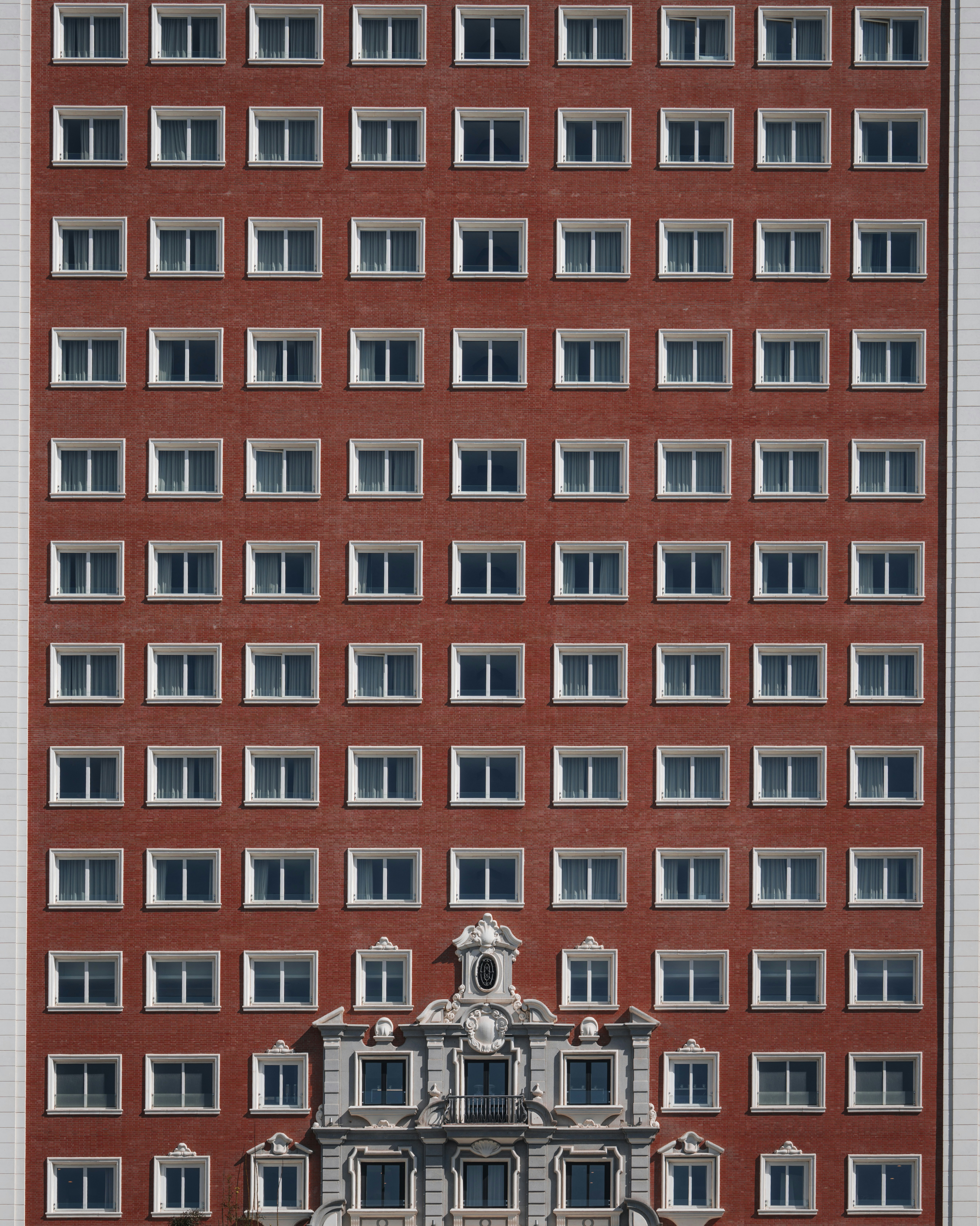 Red brick building with symmetrical windows - Free Photo on Unsplash