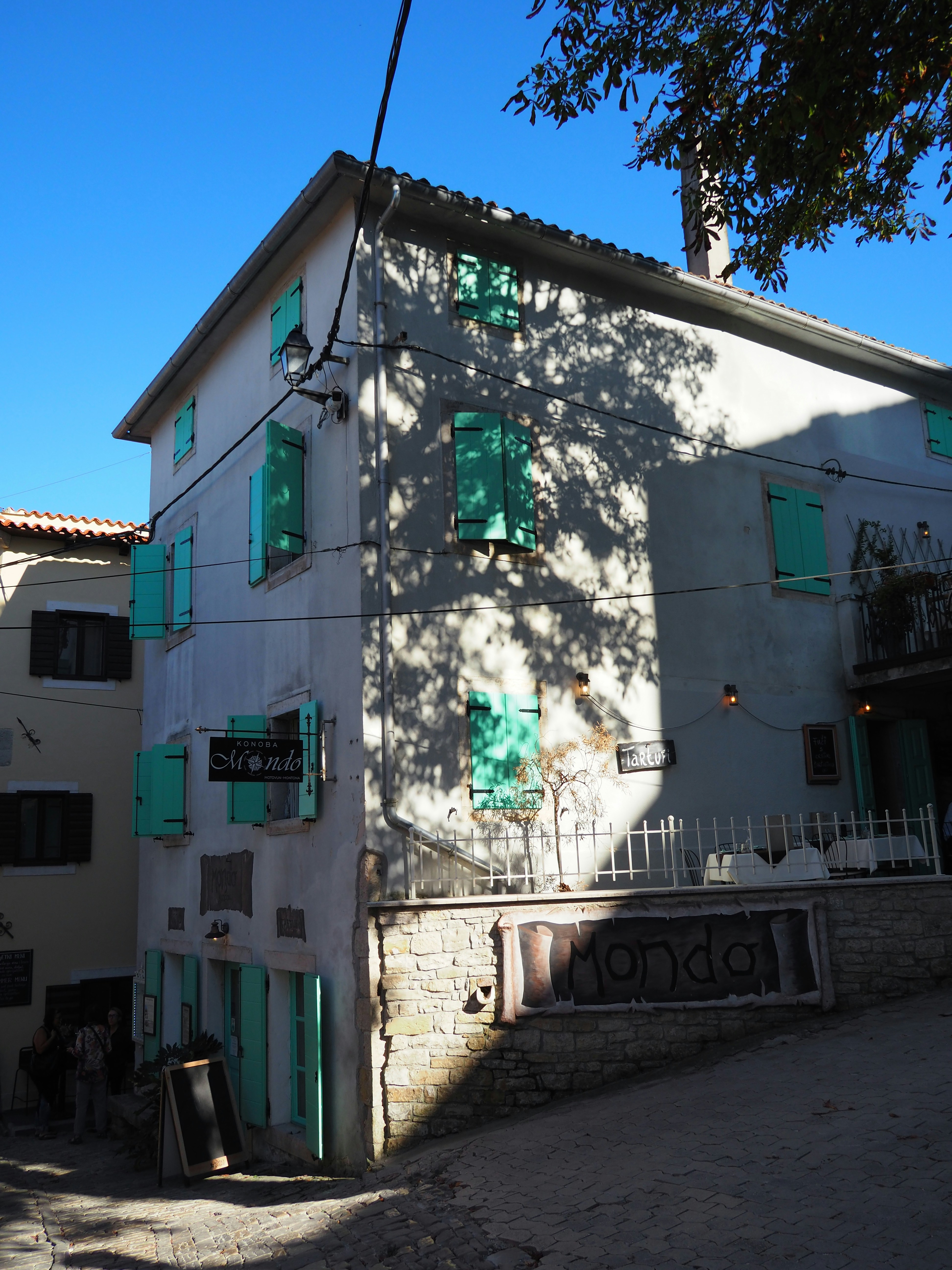 Stone building with green shutters - Free Photo on Unsplash