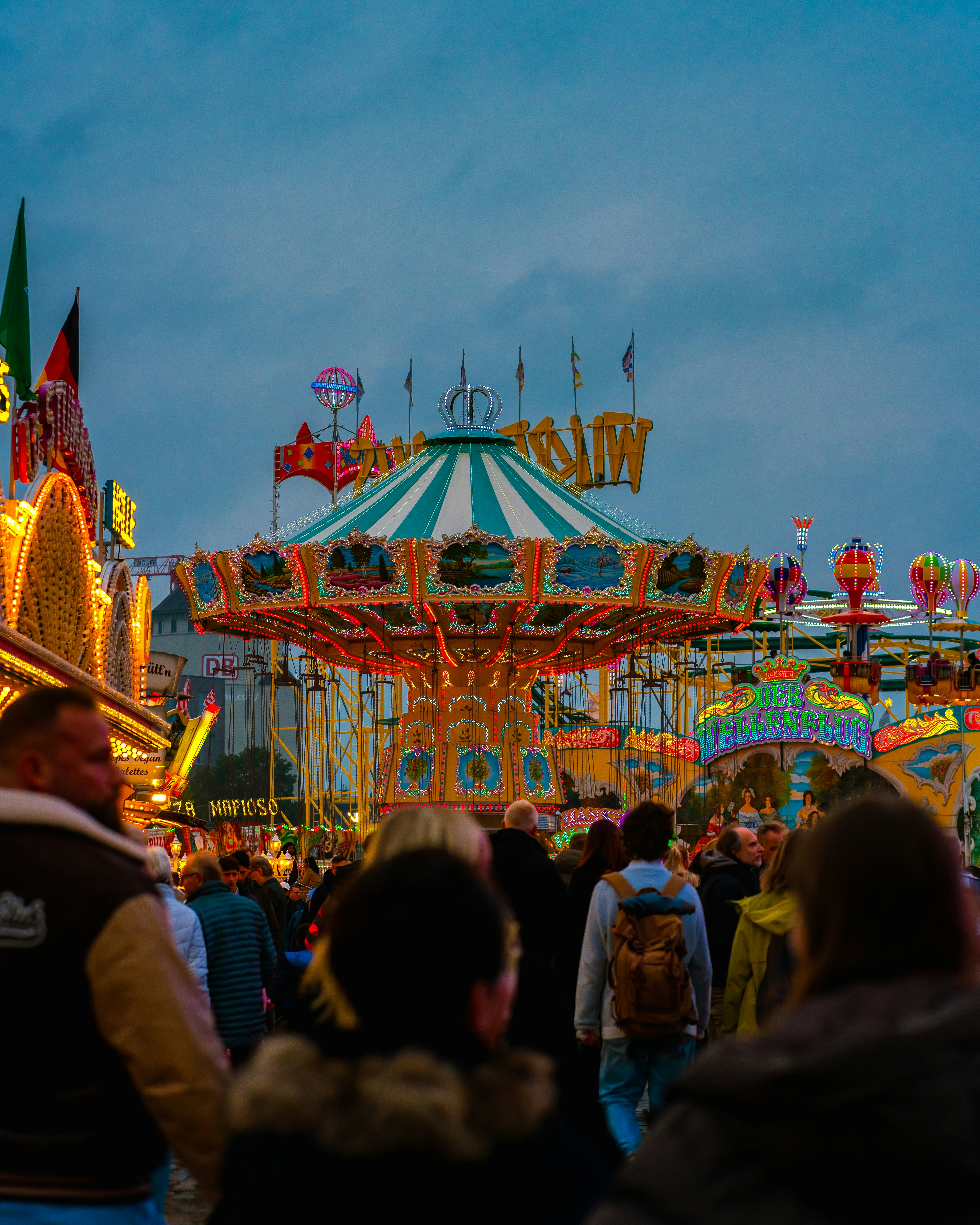 Carnival swing ride with crowd - Free Photo on Unsplash