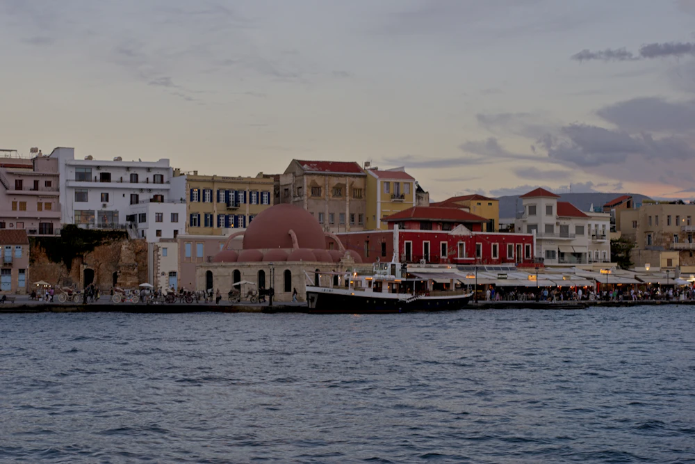 The Venetian harbor of Chania on Crete, with its domed old mosque and colorful houses on the waterfront