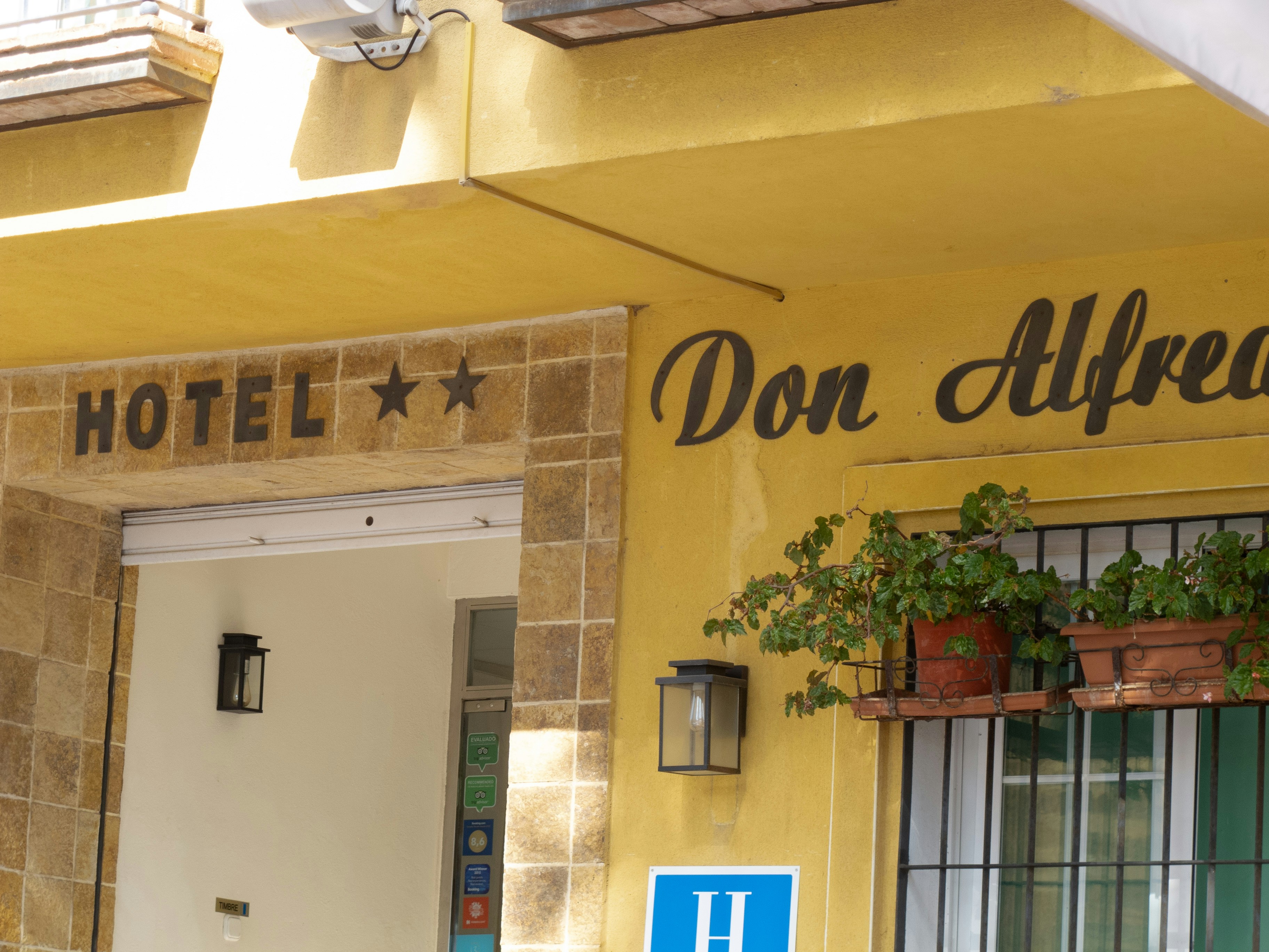 Hotel facade with yellow walls - Free Photo on Unsplash