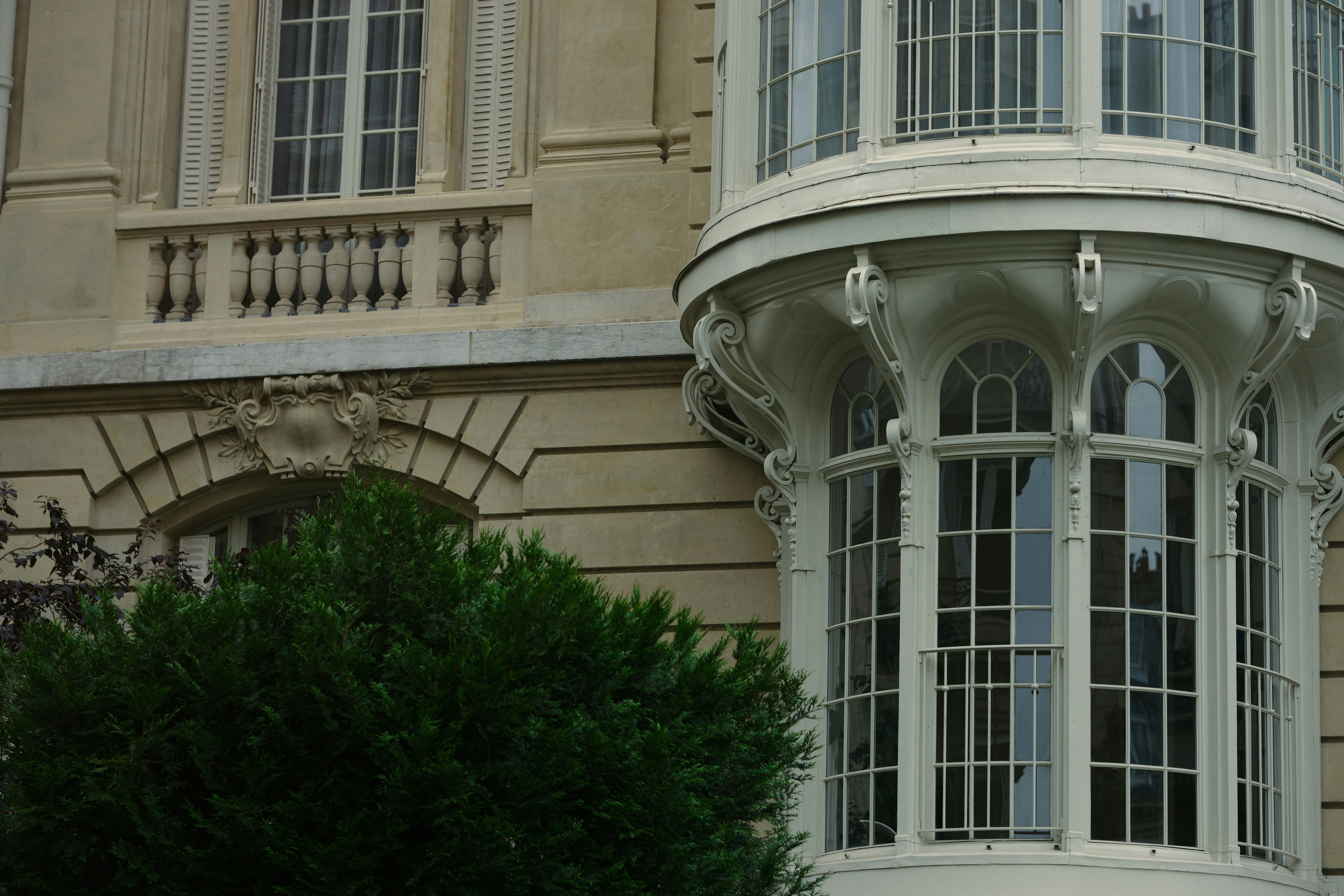 Curved bay window on stone building - Free Photo on Unsplash