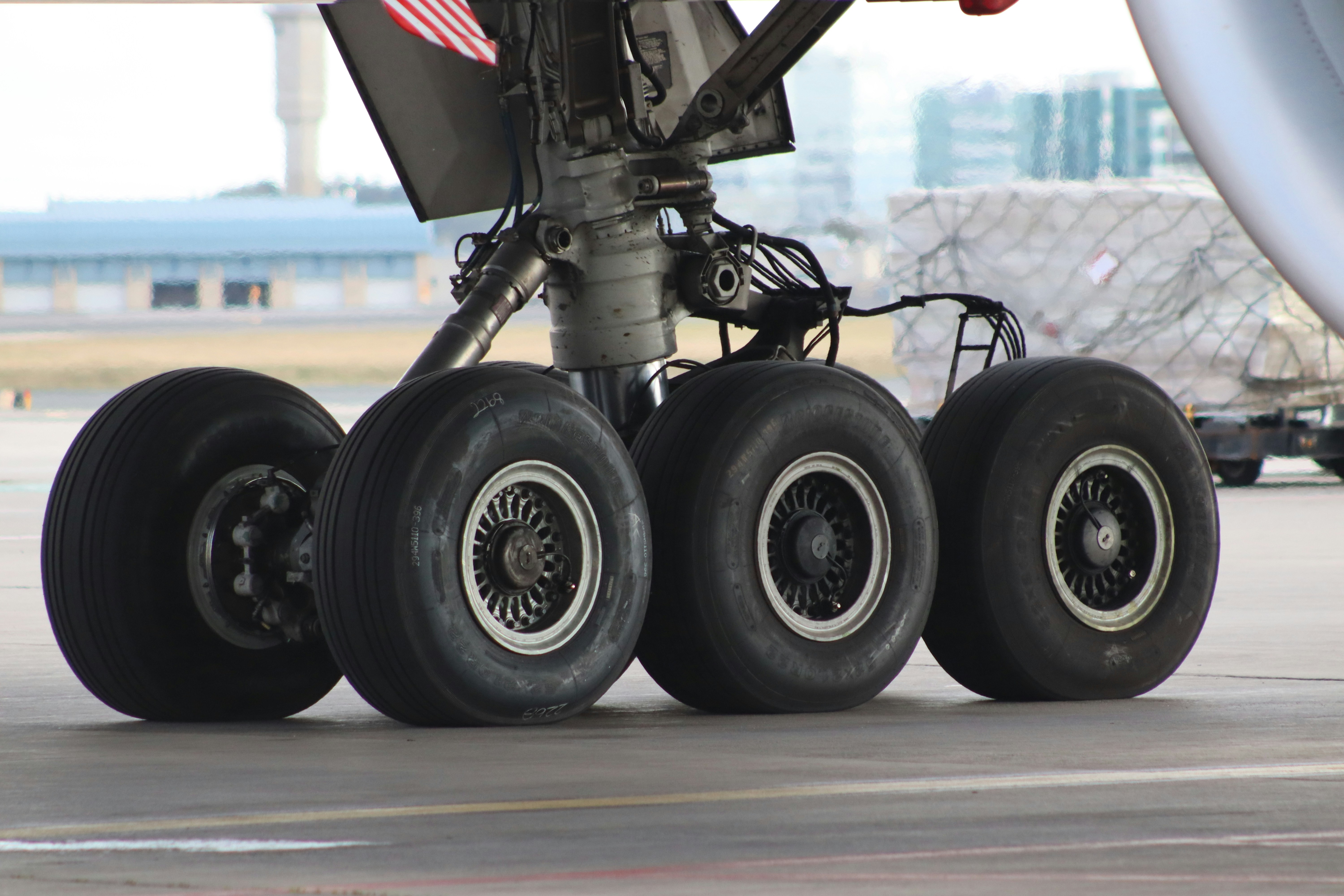 Aircraft landing gear on concrete tarmac - Free Photo on Unsplash