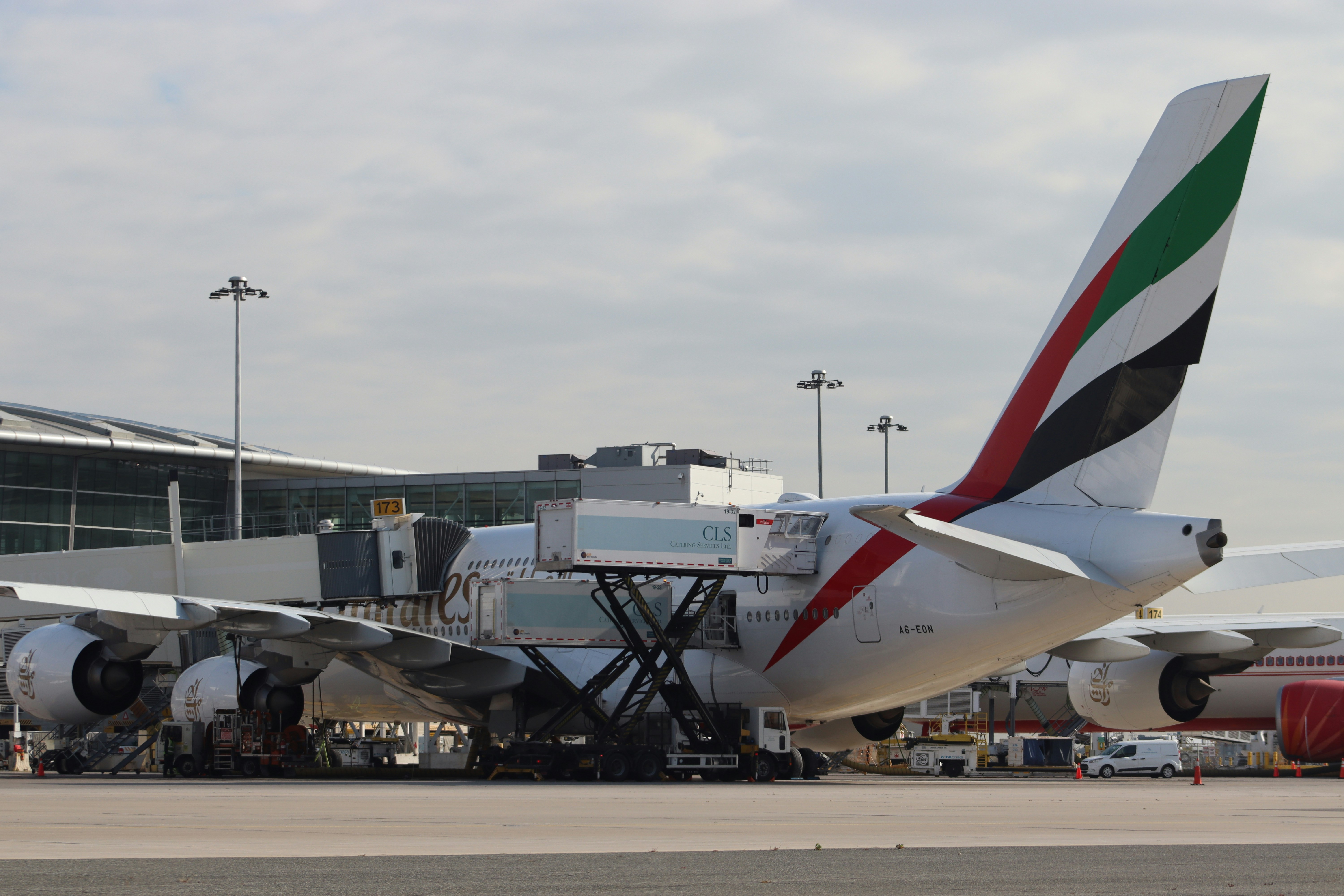 Emirates passenger jet at airport gate - Free Photo on Unsplash