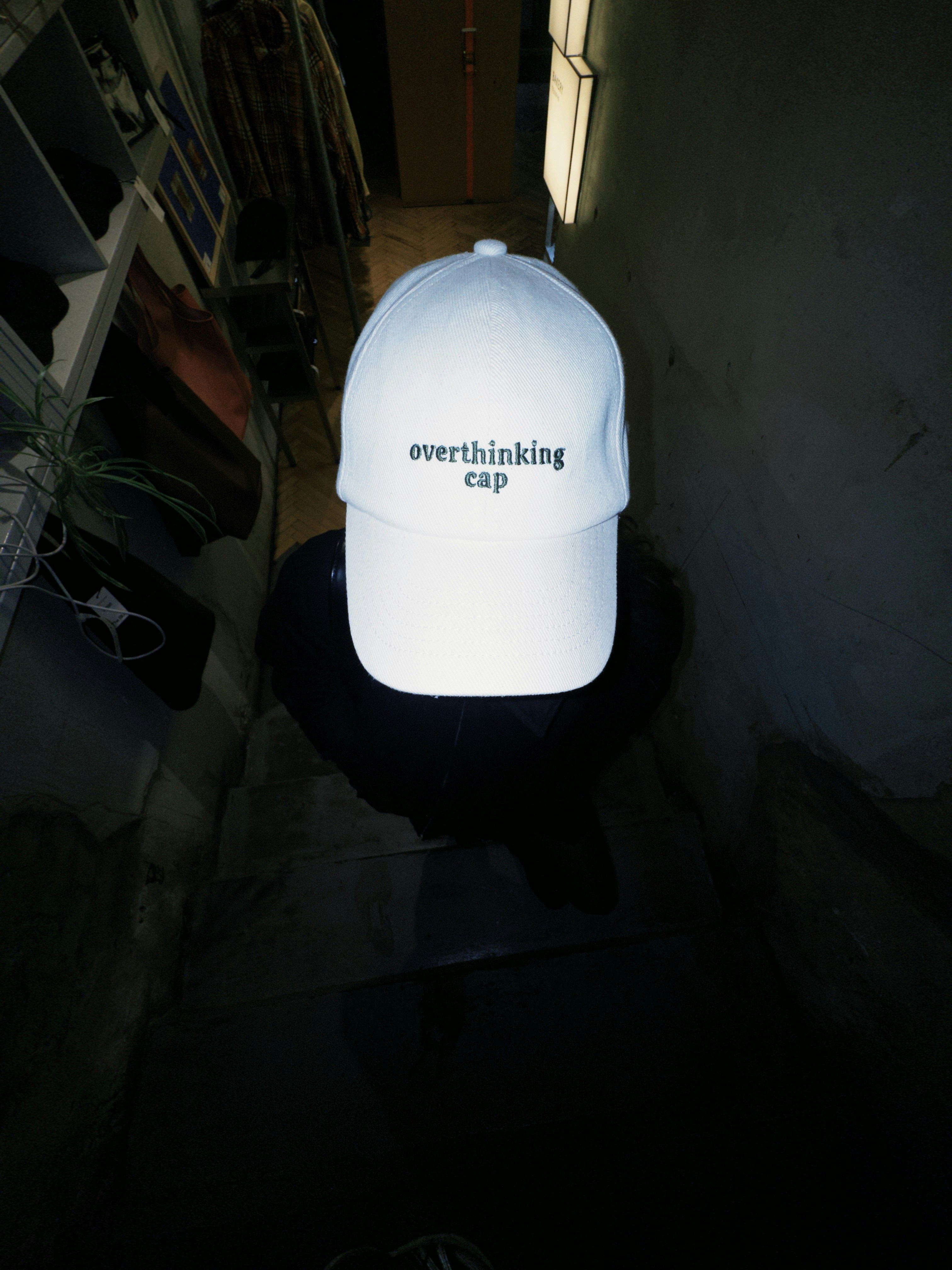 Person wearing white overthinking cap - Free Photo on Unsplash