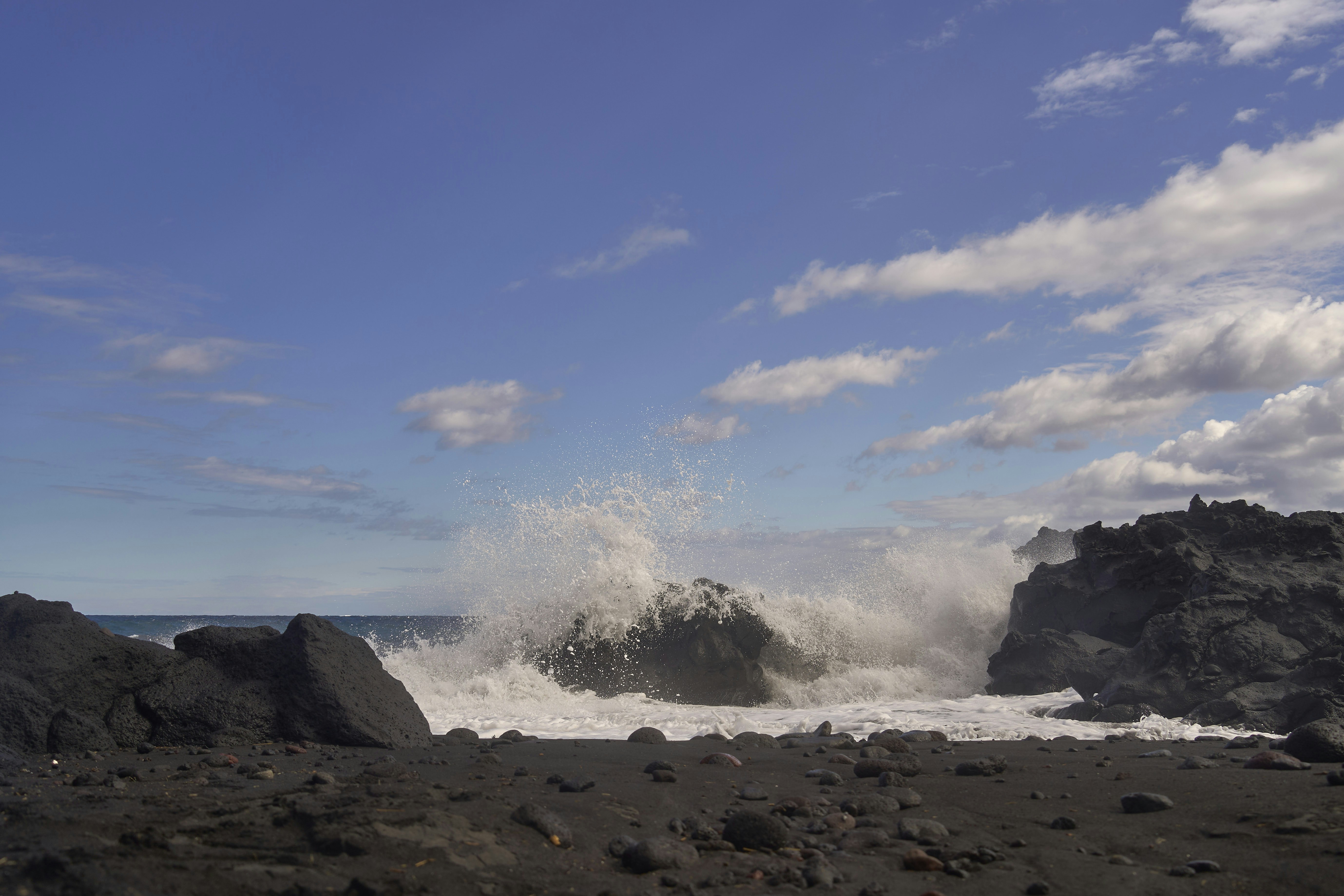 Waves crashing on black volcanic rocks - Free Photo on Unsplash