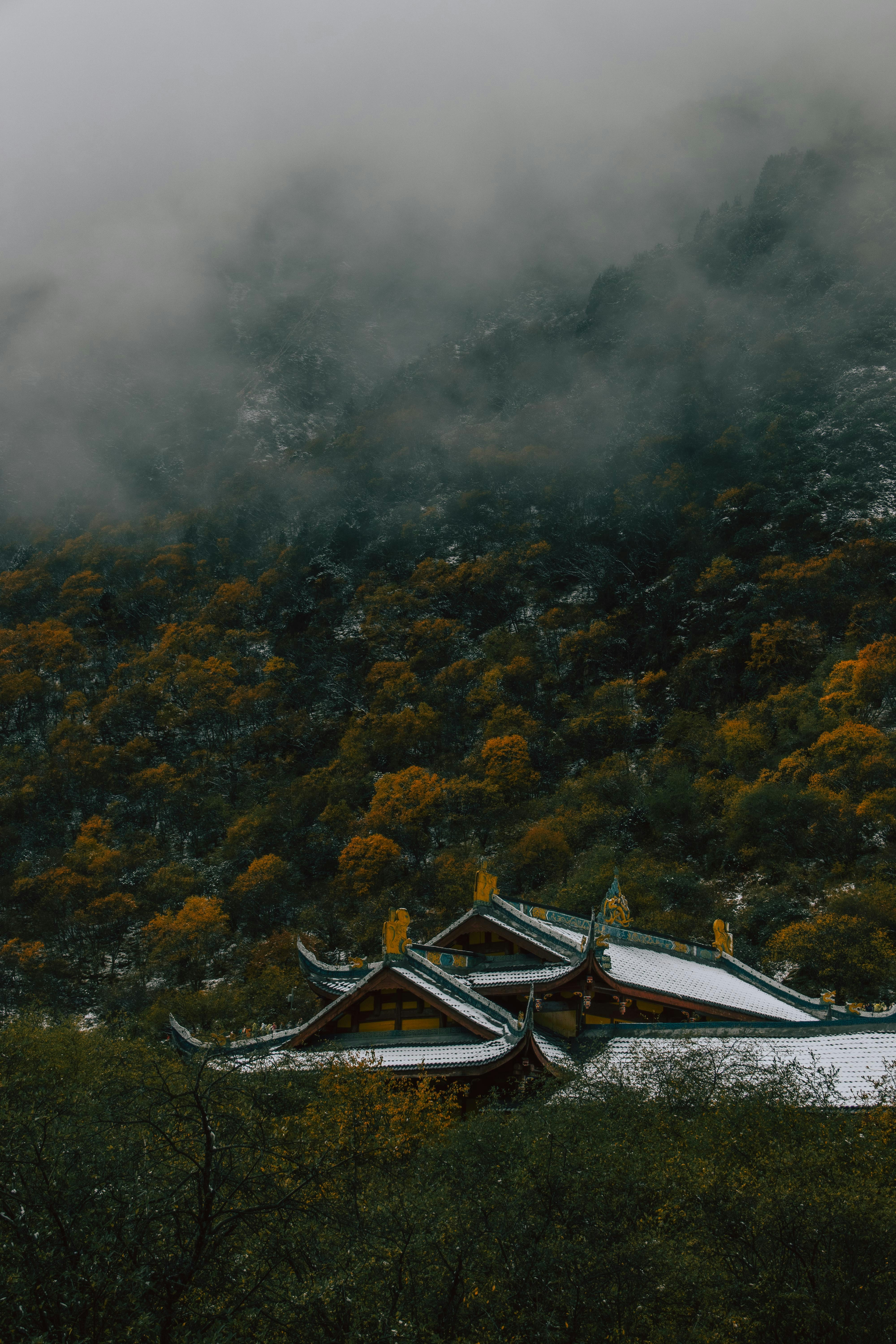 Temple roof under misty mountain - Free Photo on Unsplash